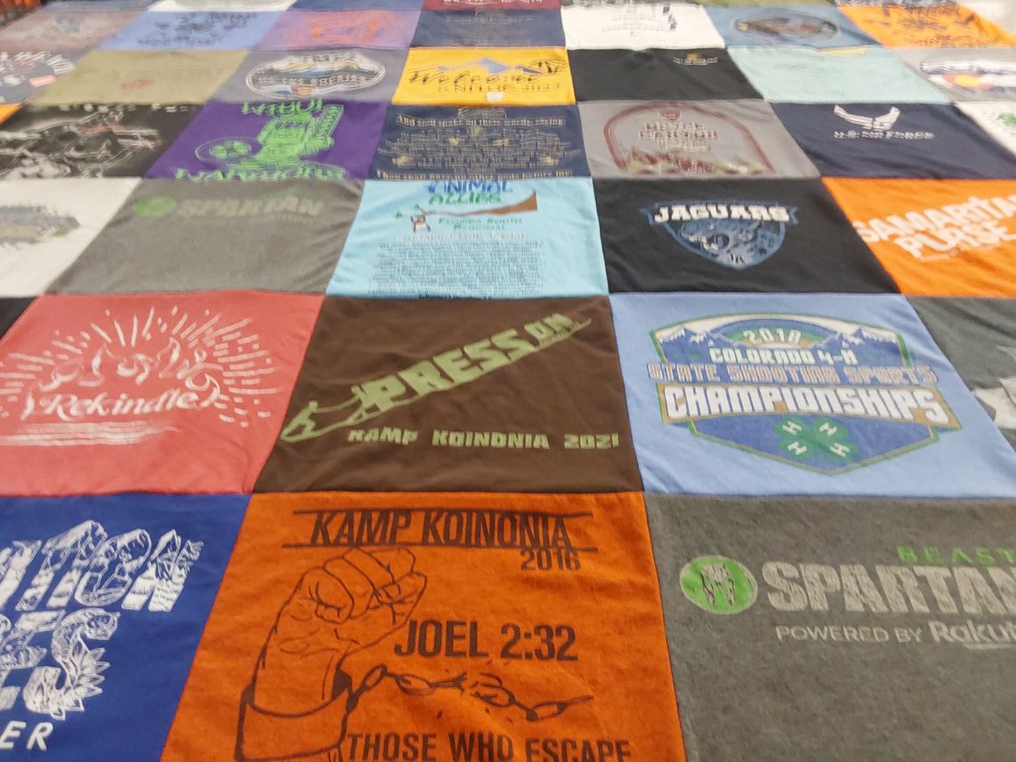 T-shirt quilt with camping, spirituality themes by Laurie from CO