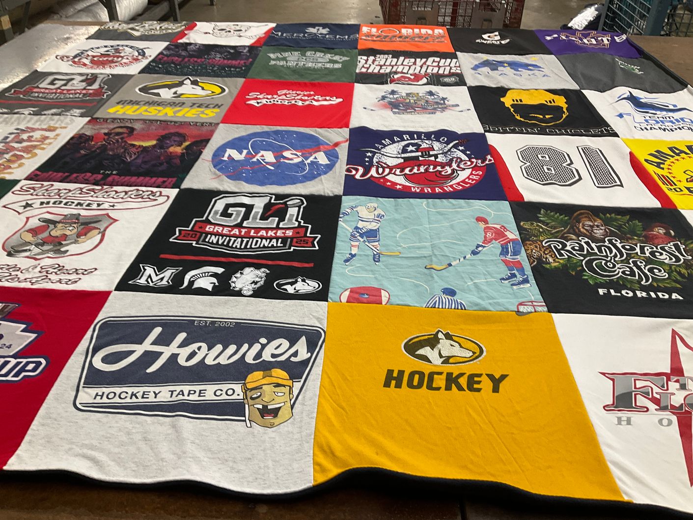 T-shirt quilt with hockey, space themes by Lisa from MI
