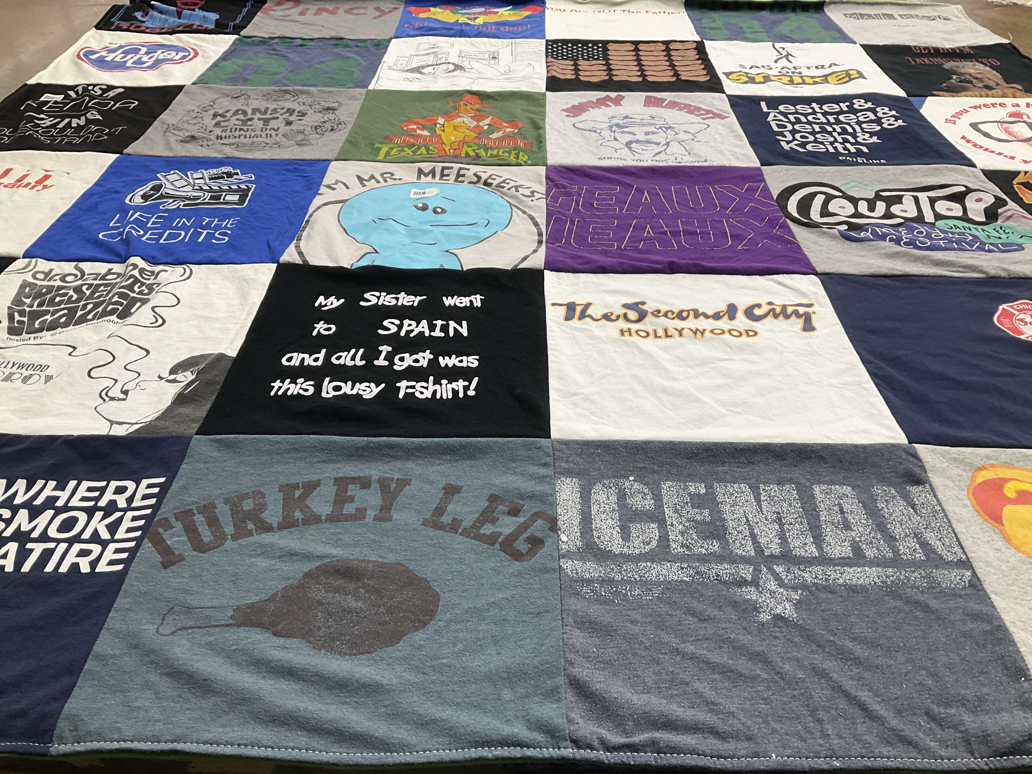 T-shirt quilt with comedy, travel themes by Julie from CA