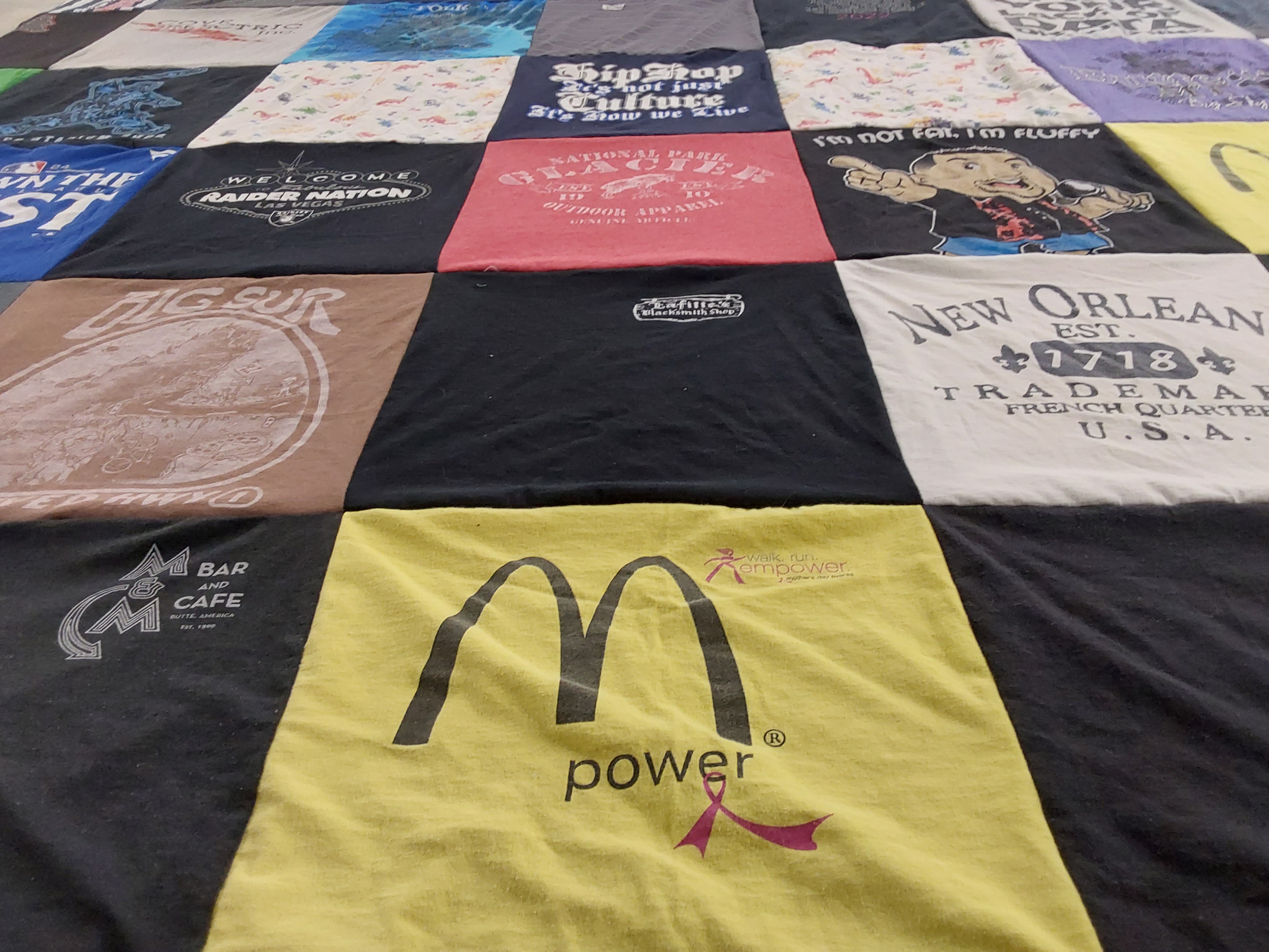 T-shirt quilt with new orleans, long beach themes by Robert from CA
