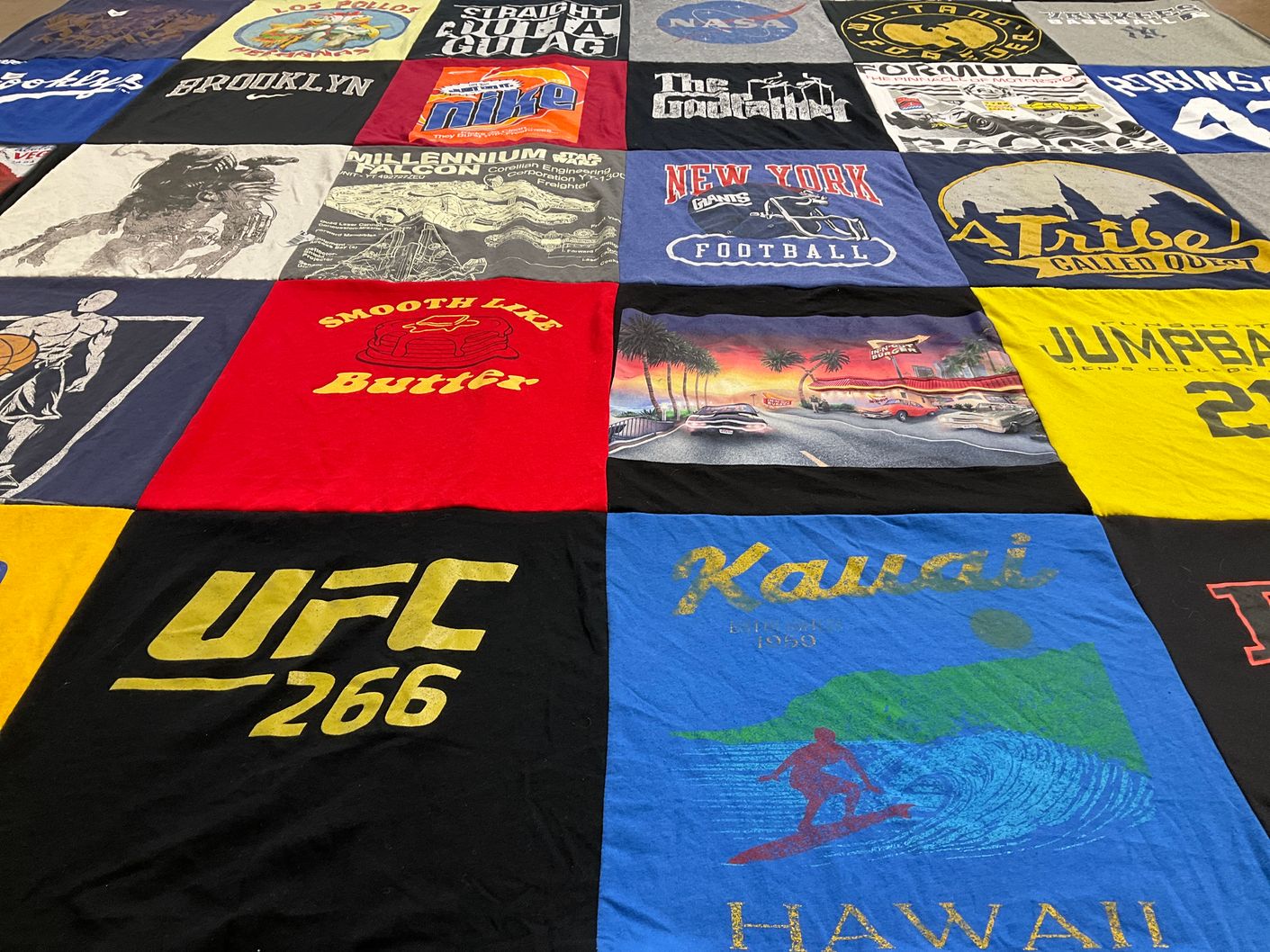 T-shirt quilt with sports, music themes by Monica from CA