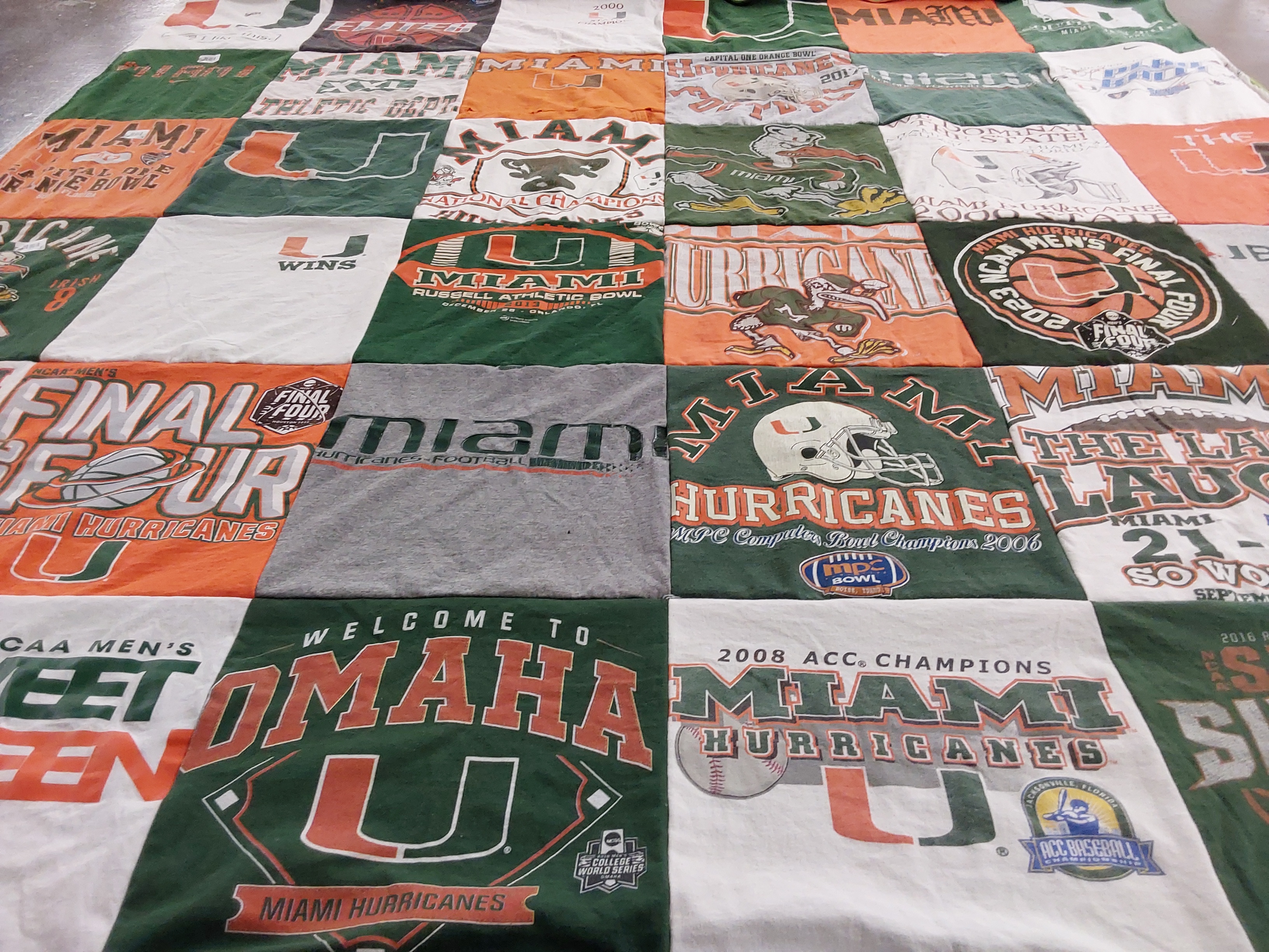 T-shirt quilt featuring miami hurricanes football team, miami hurricanes basketball team by Camila from CA