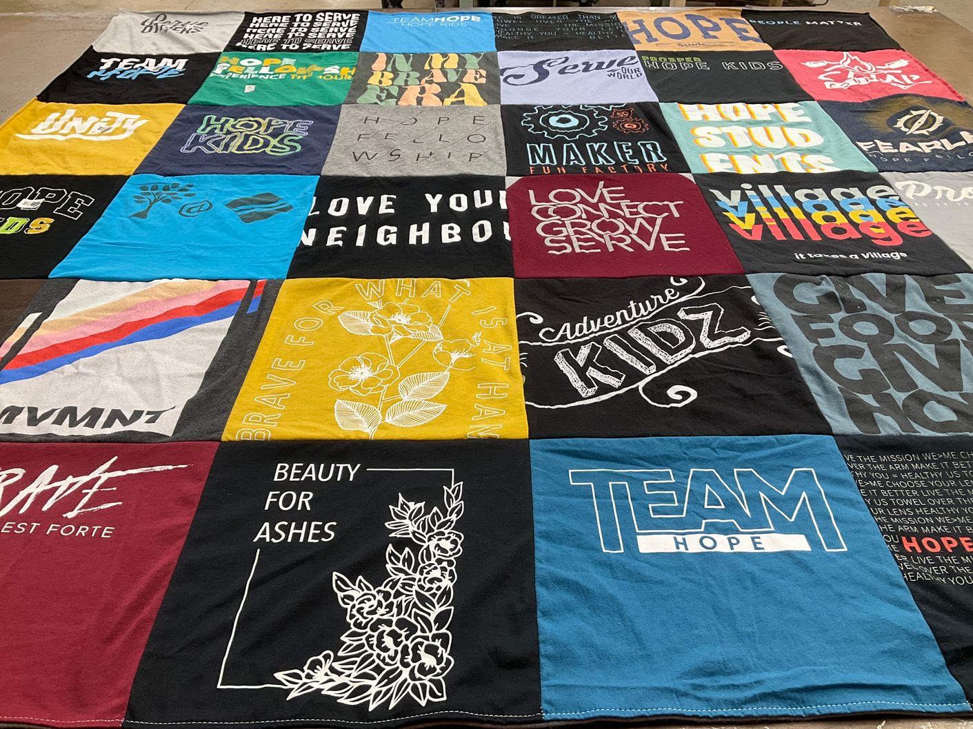 T-shirt quilt with community service, youth activities themes by Janella from TX