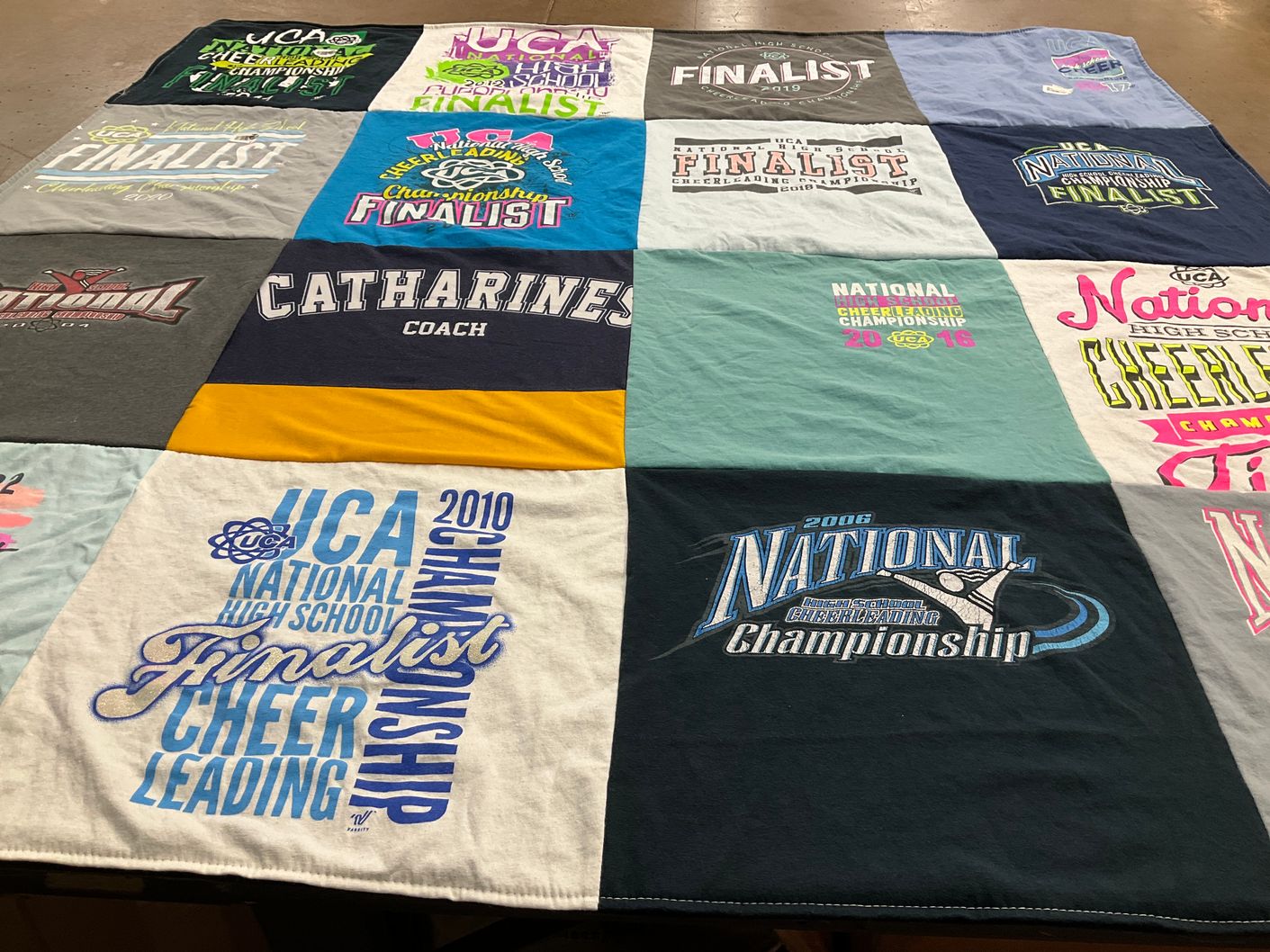 T-shirt quilt with cheerleading themes by Christine from NY