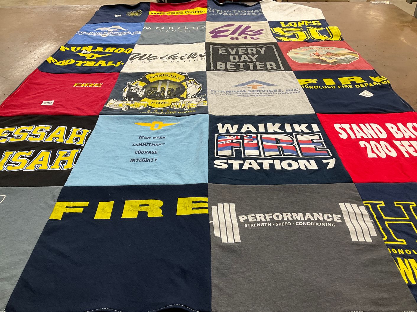 T-shirt quilt with firefighting, fitness themes by April from HI