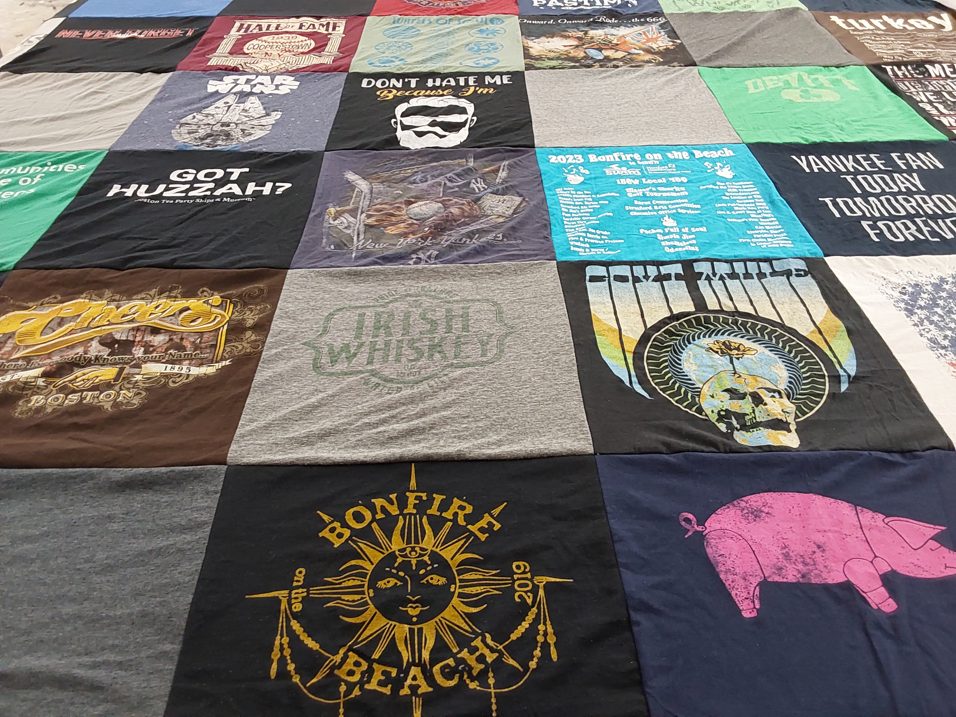 T-shirt quilt with whiskey, bonfires themes by Michele from CT