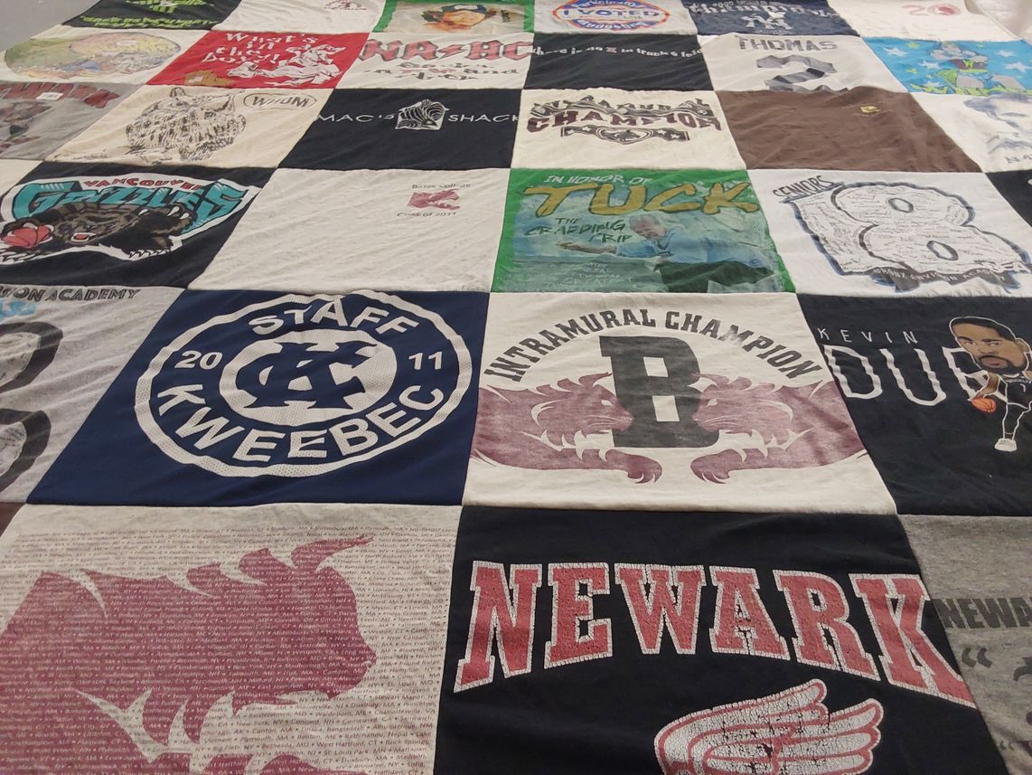 T-shirt quilt with sports, community themes by Claudia from NY