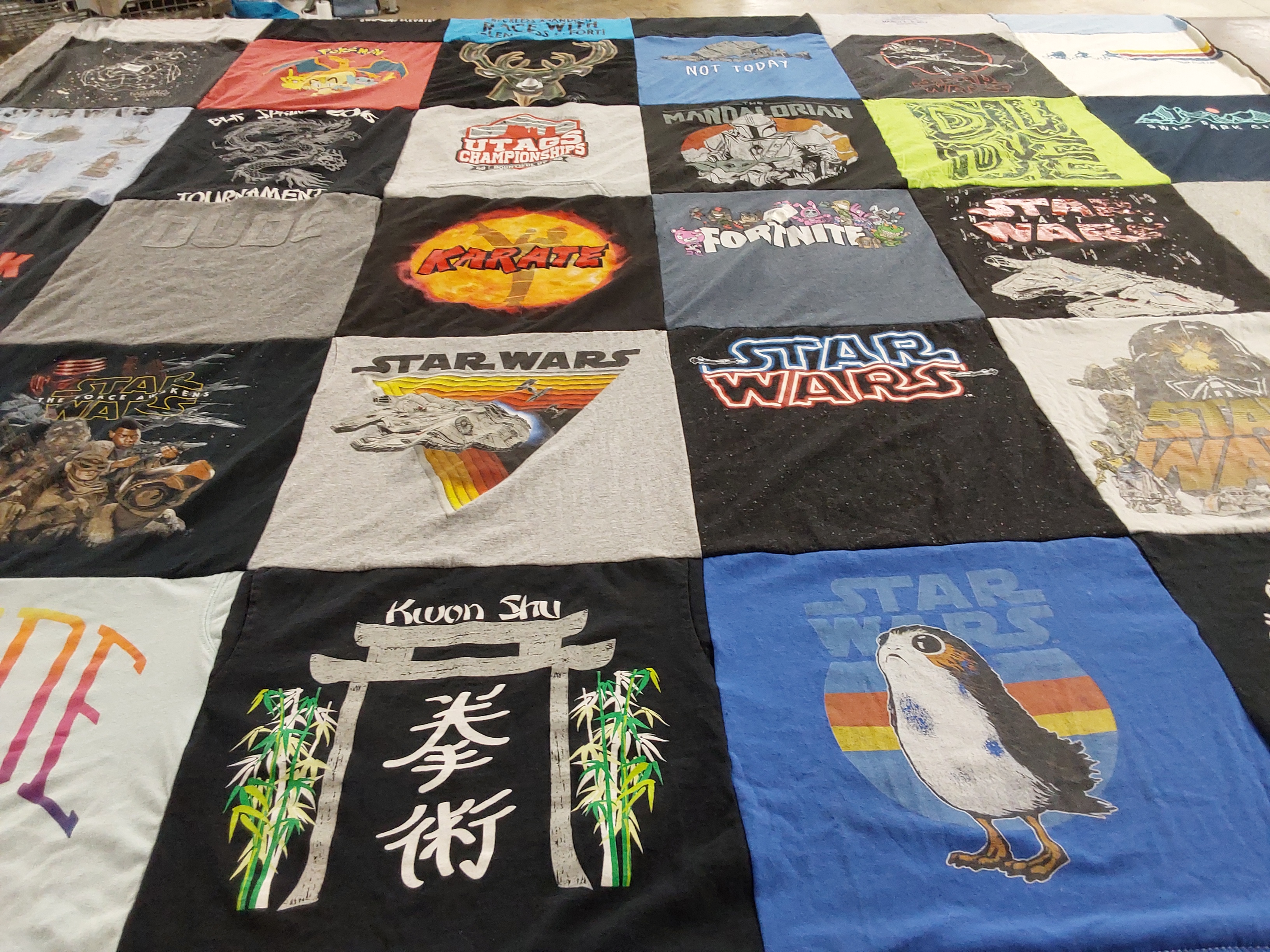 T-shirt quilt with star wars, karate themes by Jessica from UT