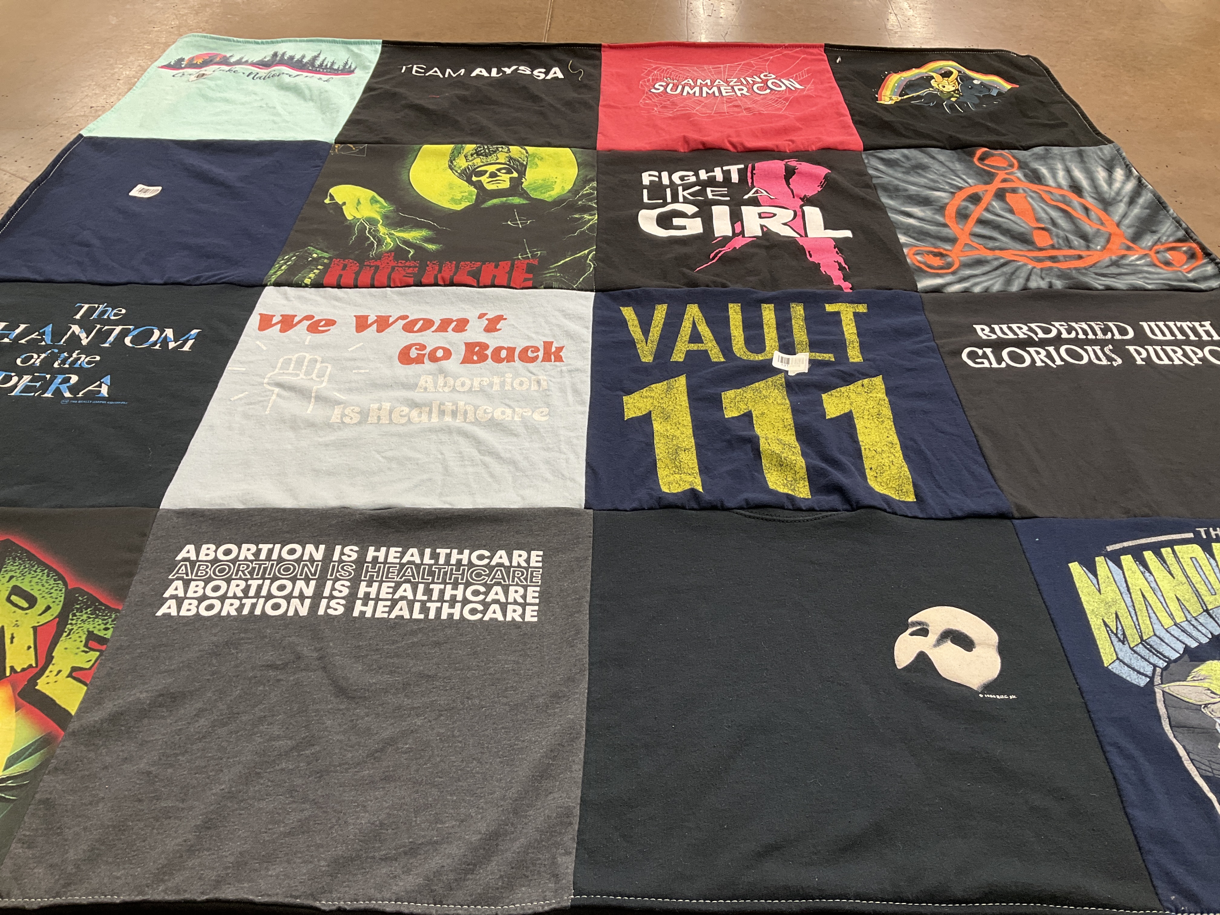 T-shirt quilt with theater, healthcare themes by Ashlee from WA