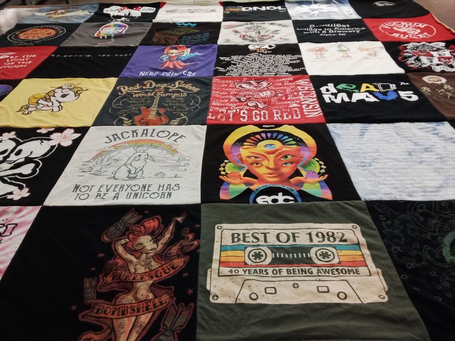 T-shirt quilt with music, art themes by Laura from WI