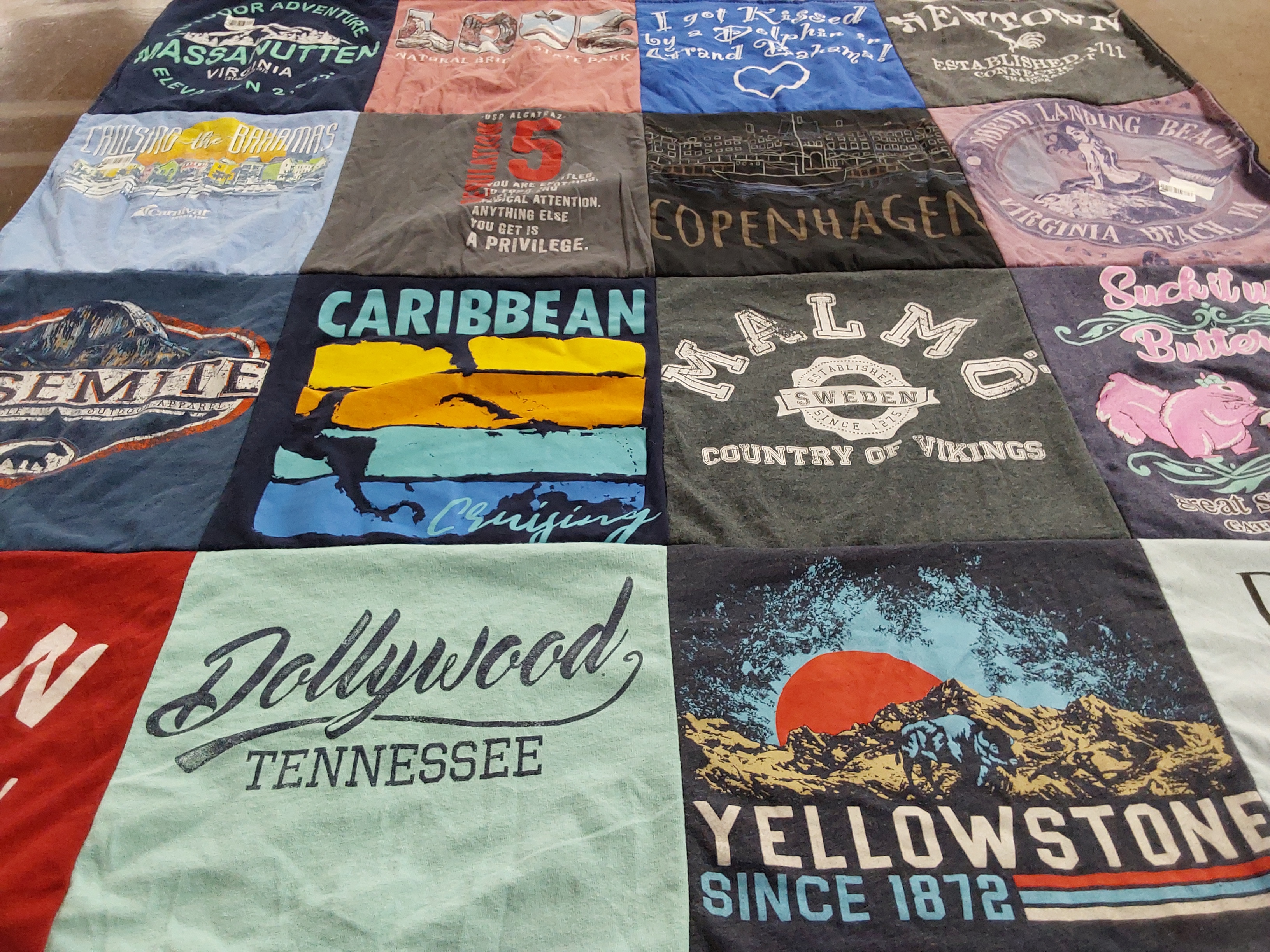 T-shirt quilt with travel, adventure themes by Sara from VA