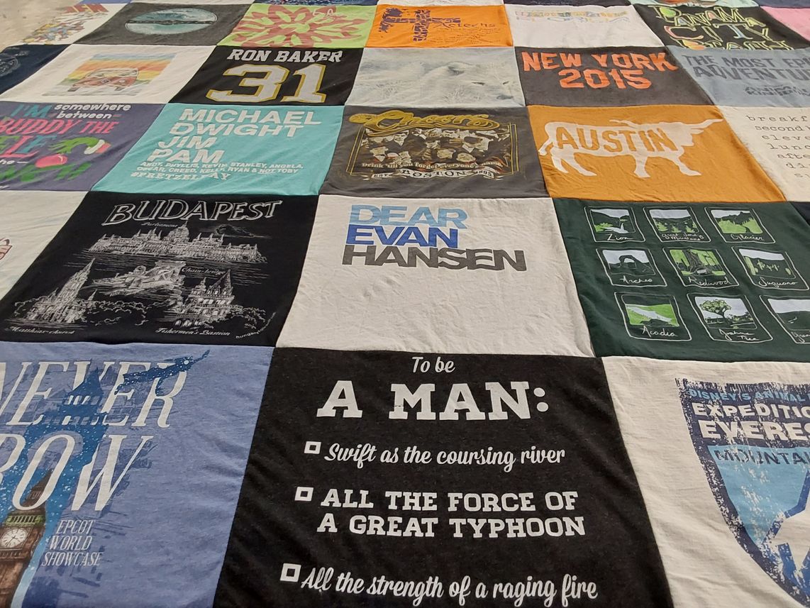 T-shirt quilt with travel, theater themes by Taylor from TX