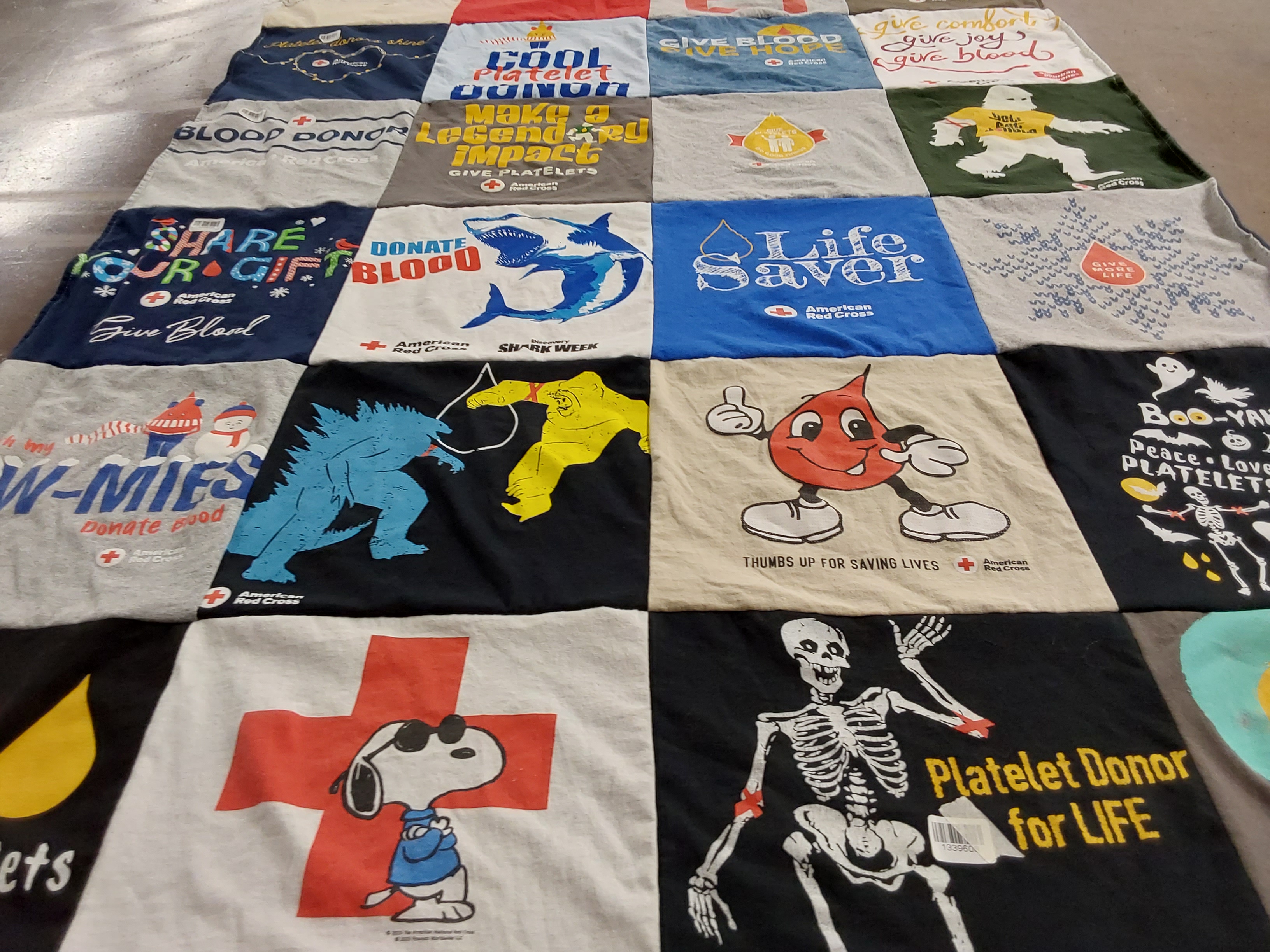 T-shirt quilt with blood donation, healthcare themes by Melissa from MN