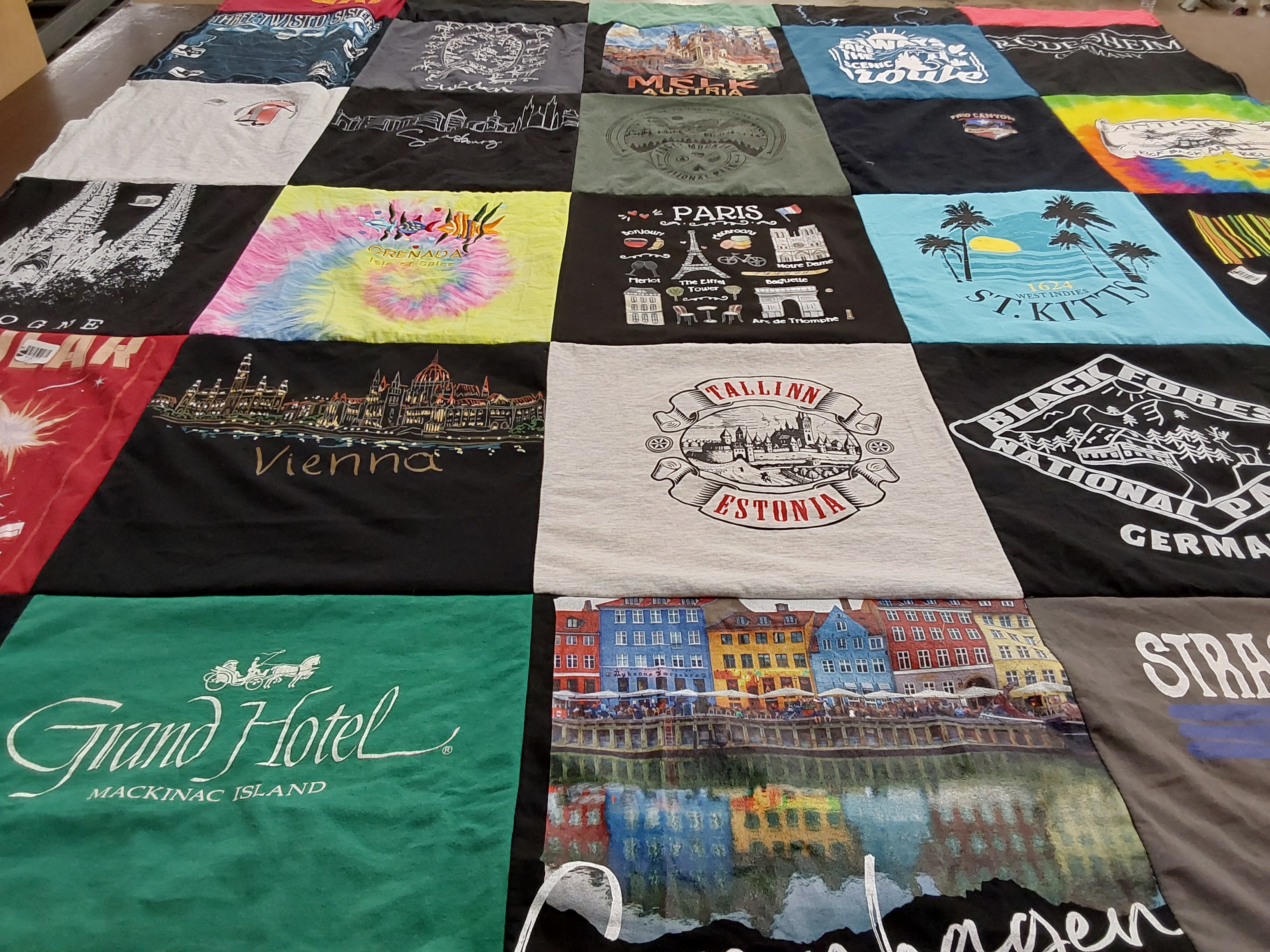 T-shirt quilt with traveling, hiking themes by Debora from FL