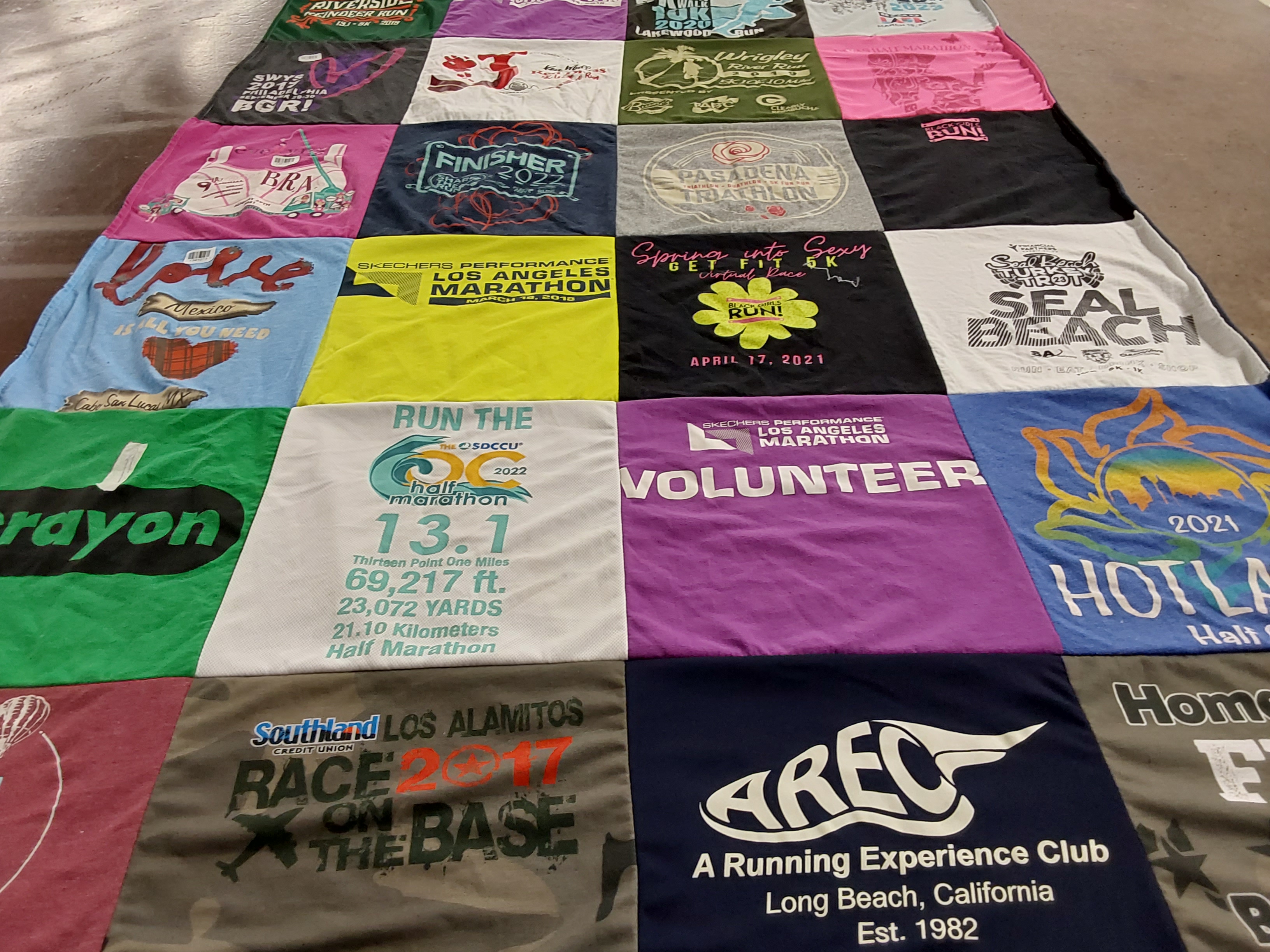 T-shirt quilt with running, volunteering themes by Gloria from CA