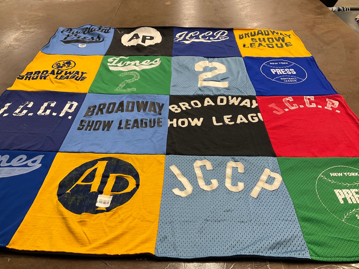 T-shirt quilt with theater, sports themes by Debbie from MD