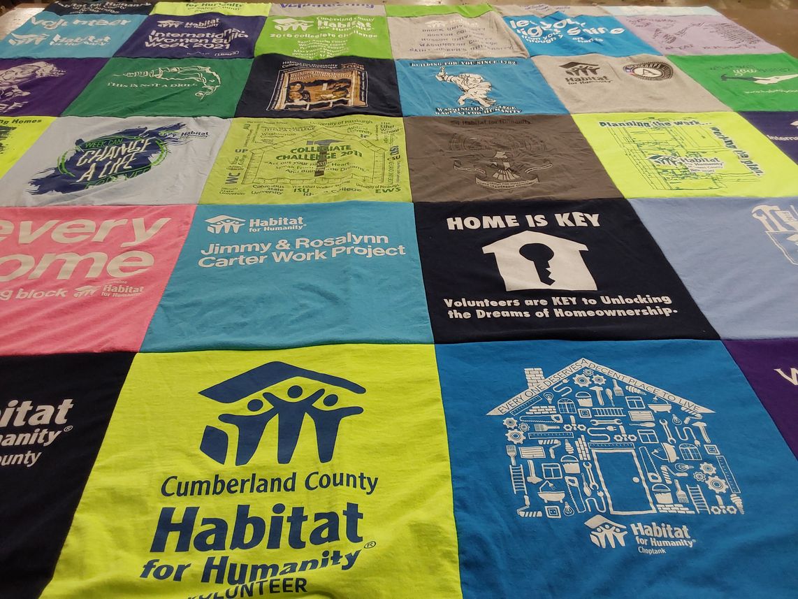 T-shirt quilt with volunteering, homeownership themes by Maria from MD