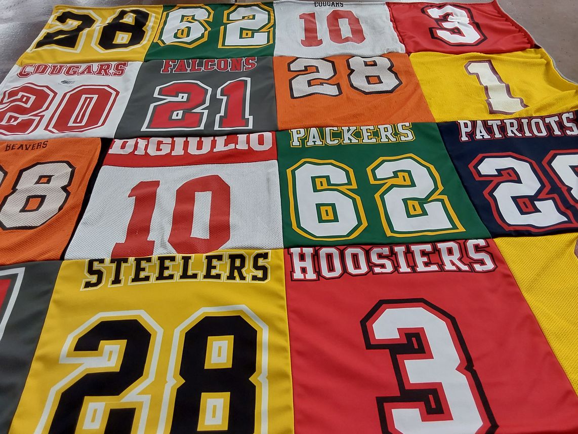 T-shirt quilt with sports, football themes by Kari from CA