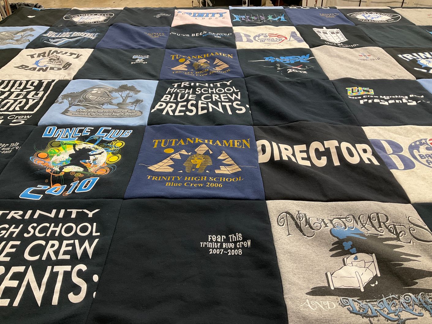 T-shirt quilt featuring trinity high school blue crew by Brian from NC