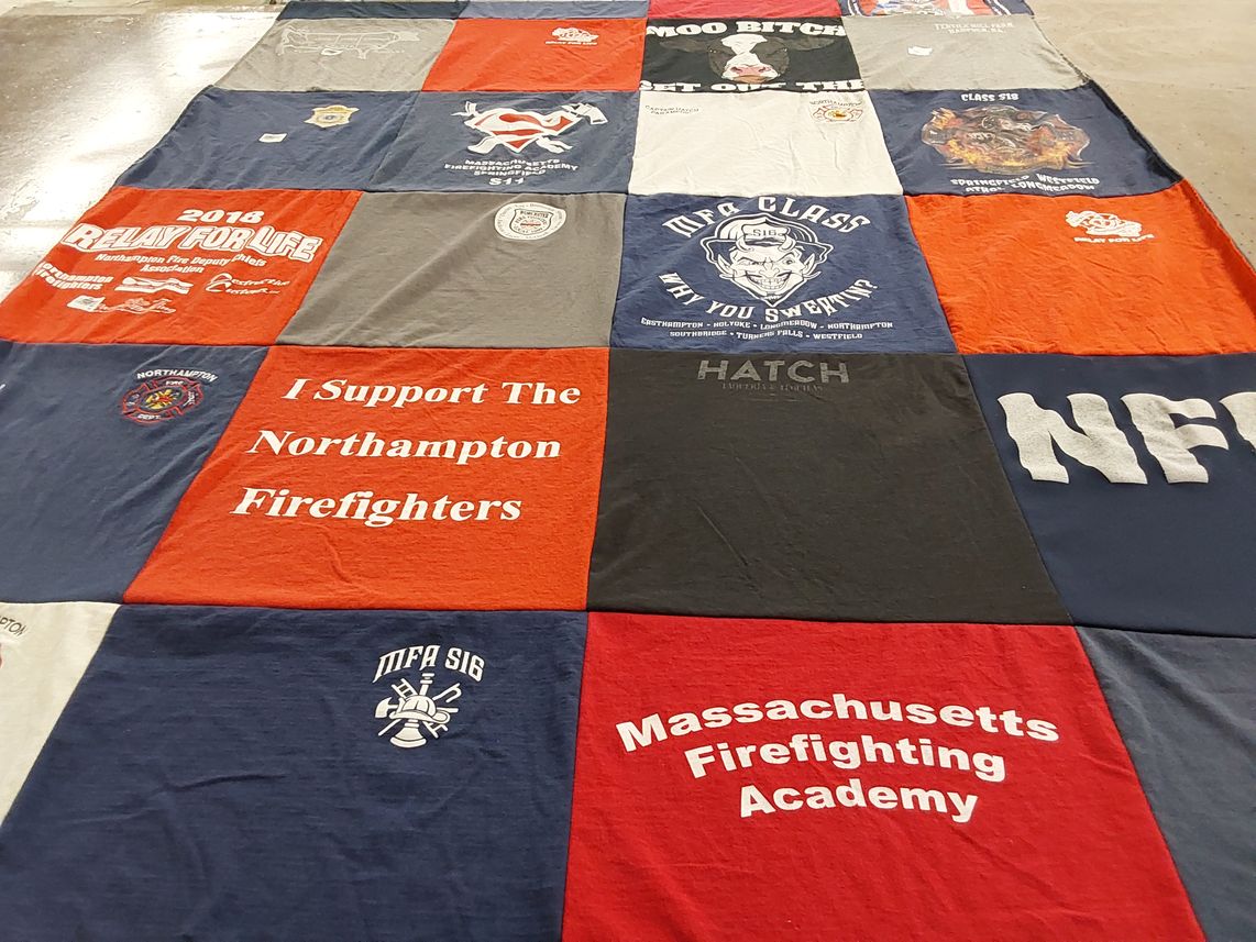 T-shirt quilt with firefighting, community support themes by Michael from MA