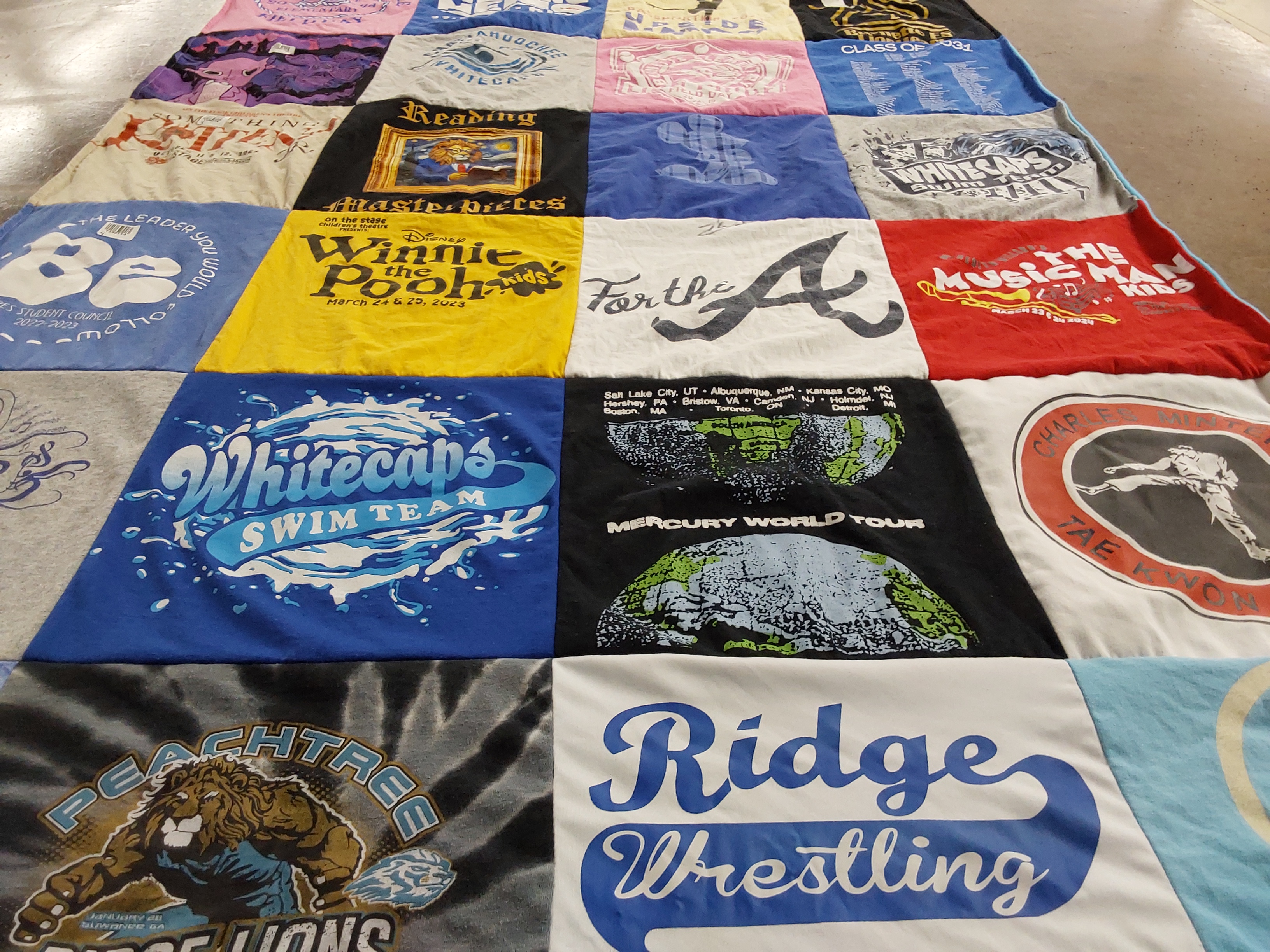 T-shirt quilt featuring whitecaps swim team, ridge wrestling by Jessica from GA