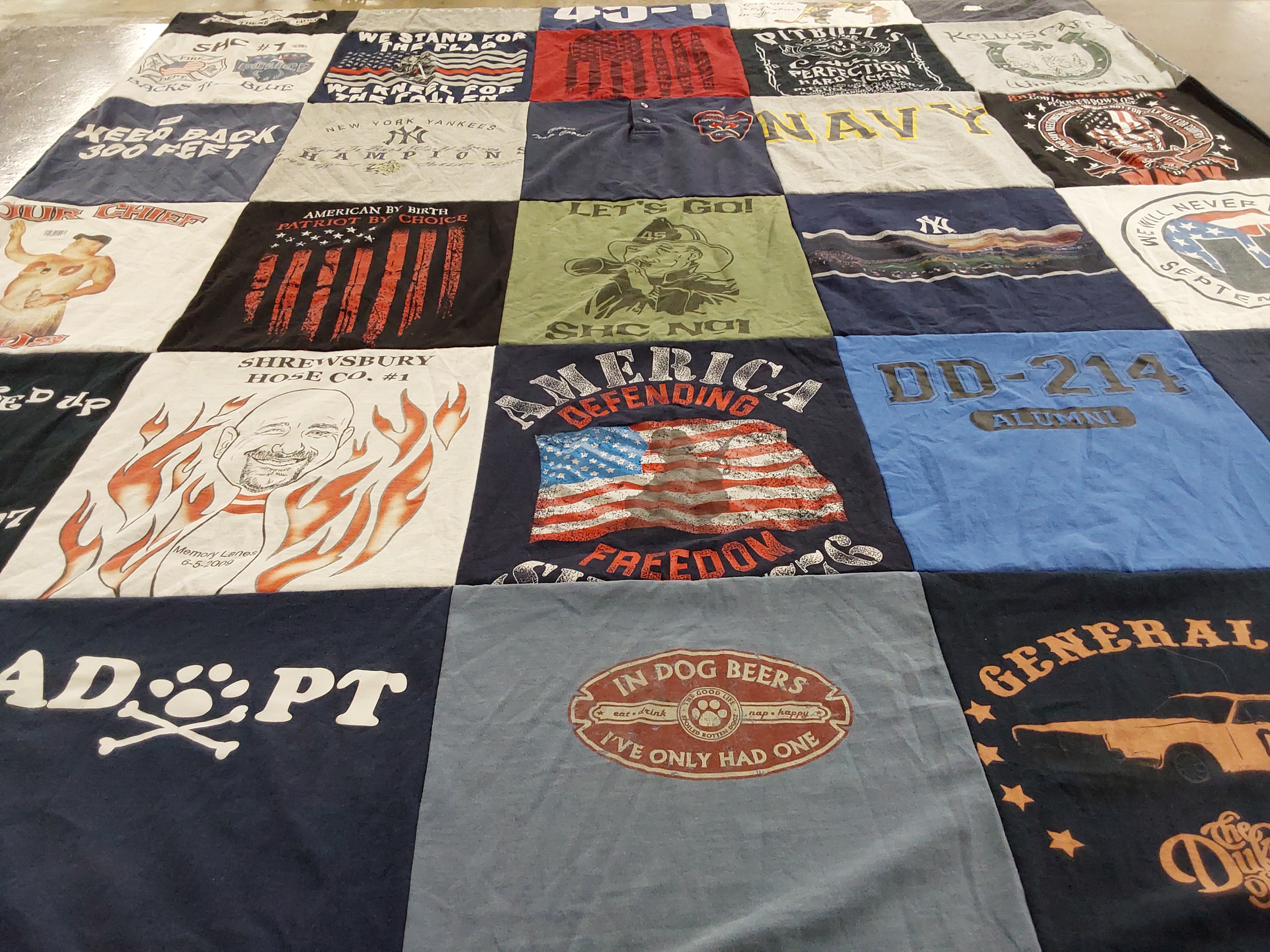 T-shirt quilt with military, firefighting themes by Suzanne from NJ