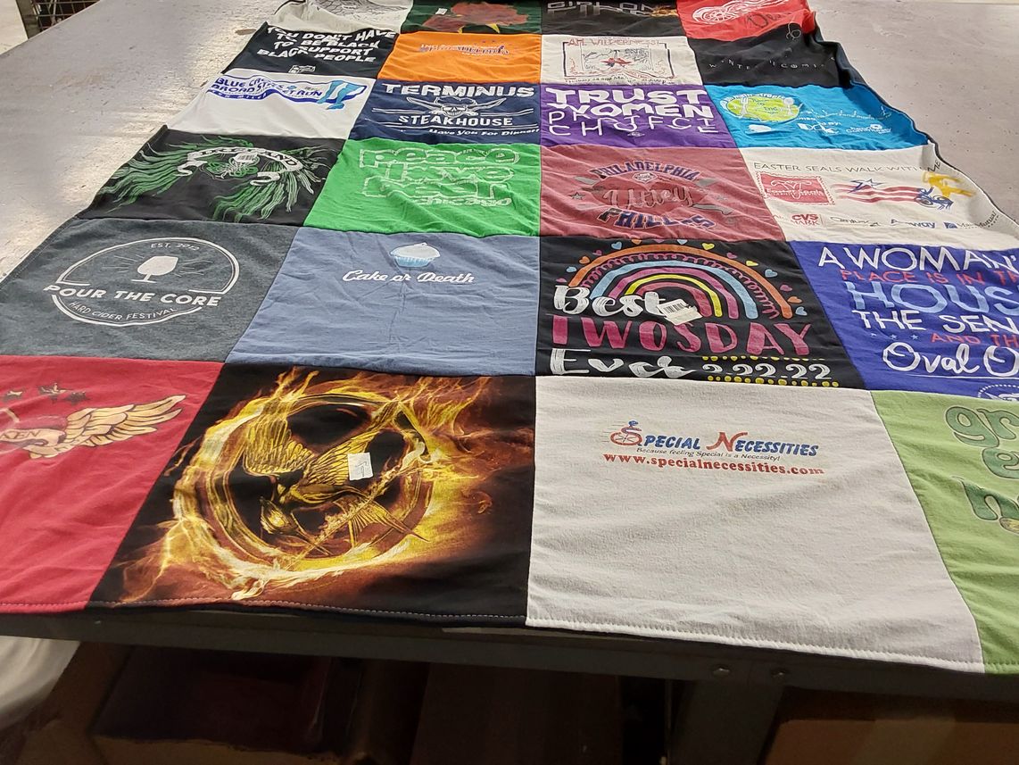 T-shirt quilt with events, festivals themes by Kari from PA