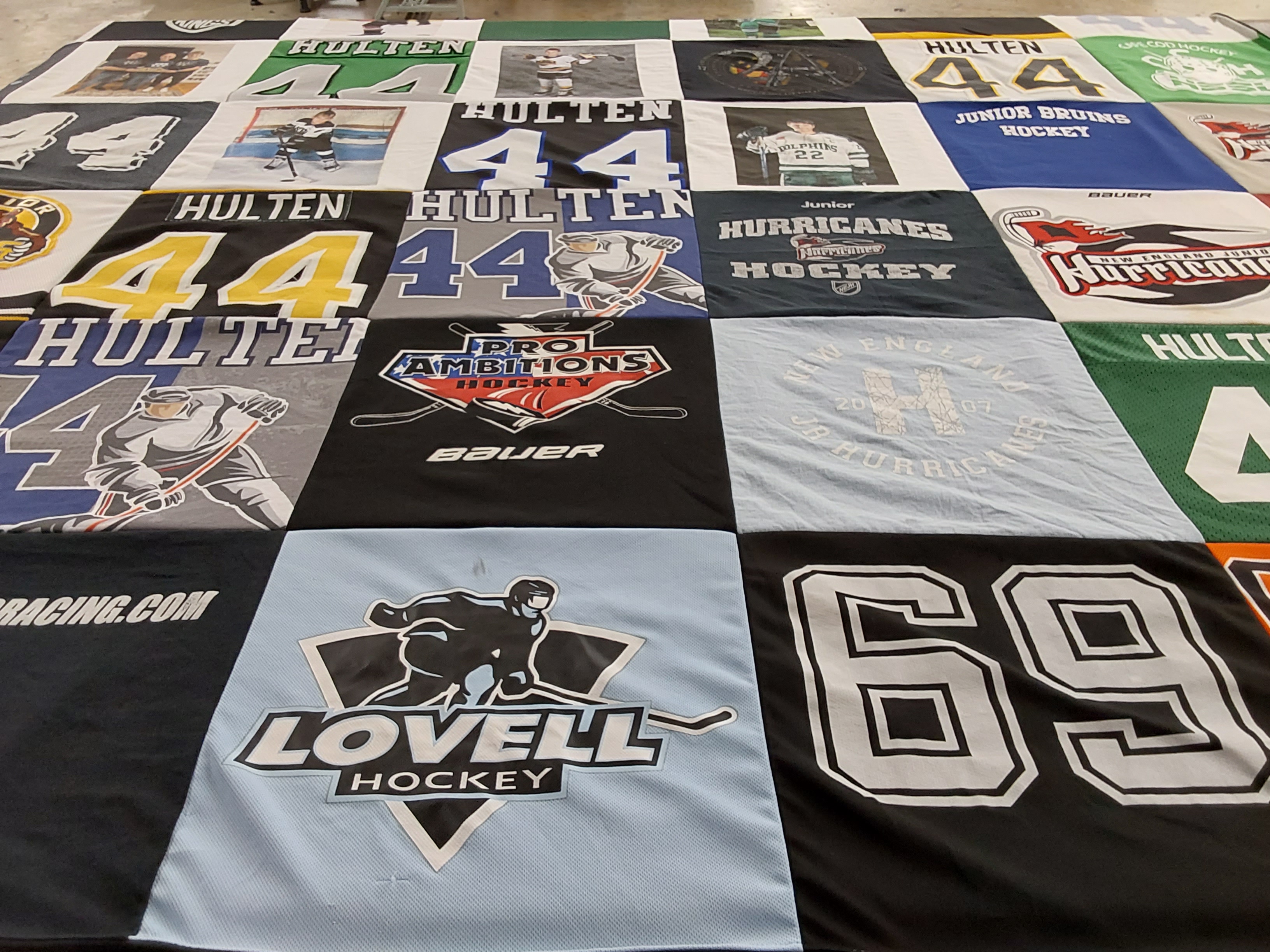 T-shirt quilt with hockey themes by laurie from MA