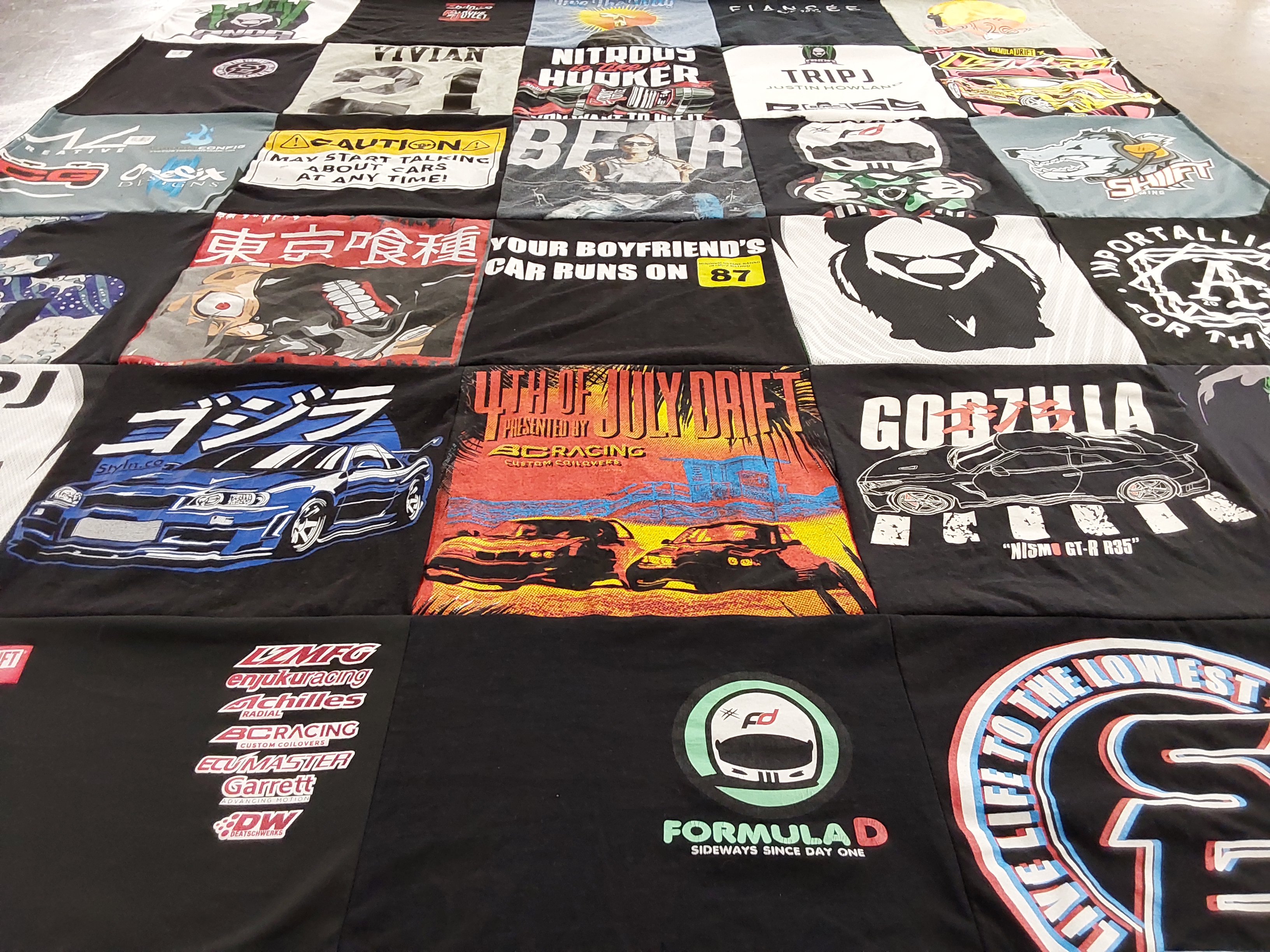 T-shirt quilt with drifting, racing themes by Vivian from GA