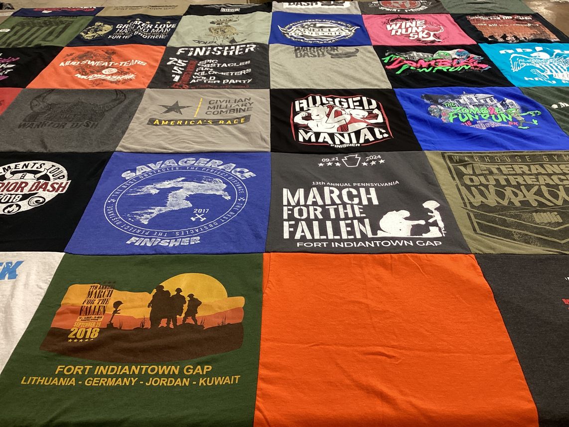 T-shirt quilt with running, military themes by Katrina from PA