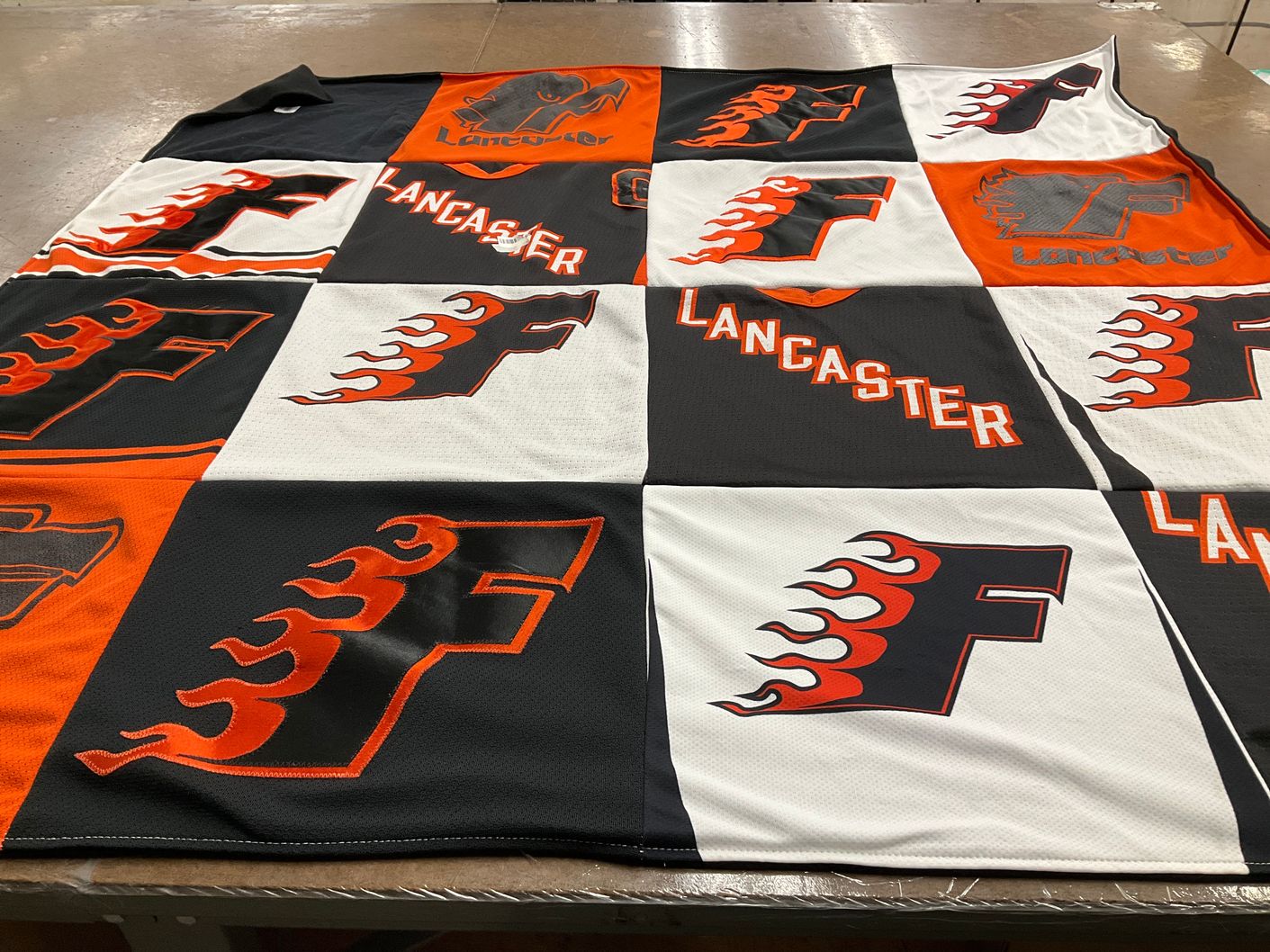 T-shirt quilt with sports themes by Amy from PA