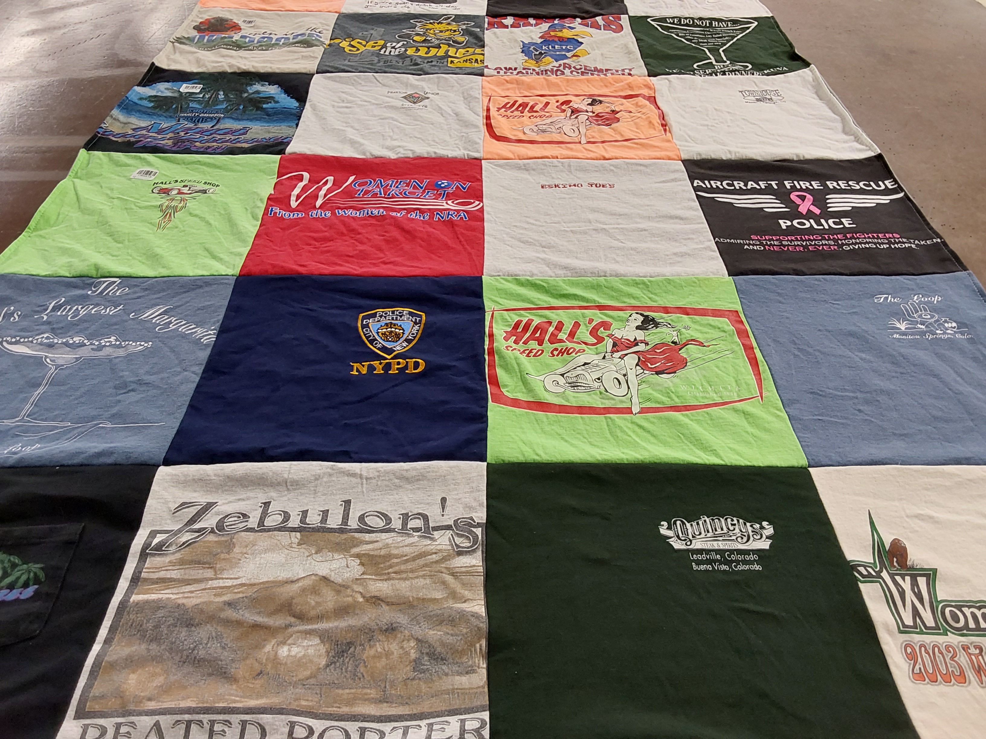 T-shirt quilt with fire rescue, law enforcement themes by Vicky from KS