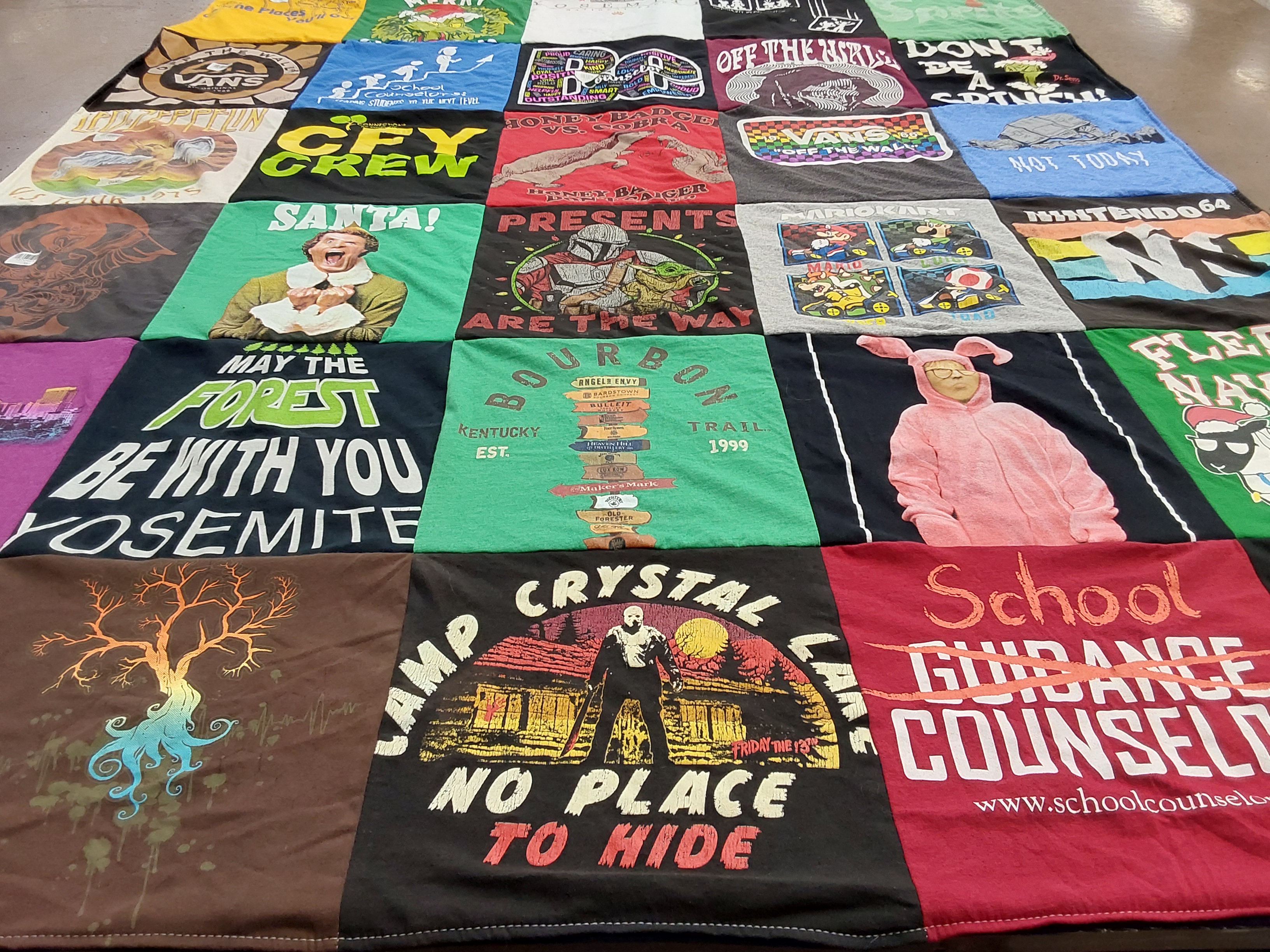 T-shirt quilt with camping, movies themes by Samantha from CA