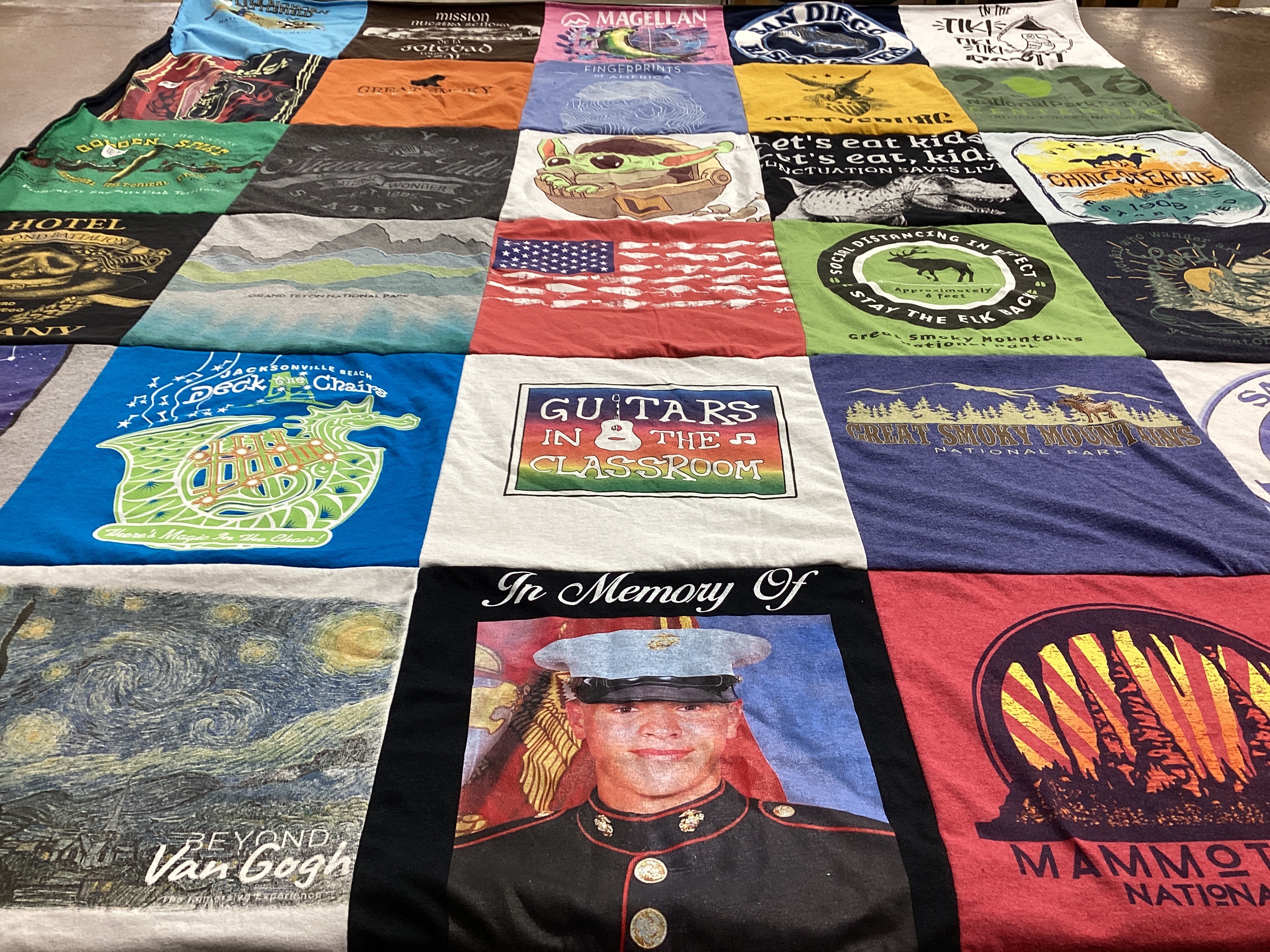 T-shirt quilt with art, music themes by Janice from FL