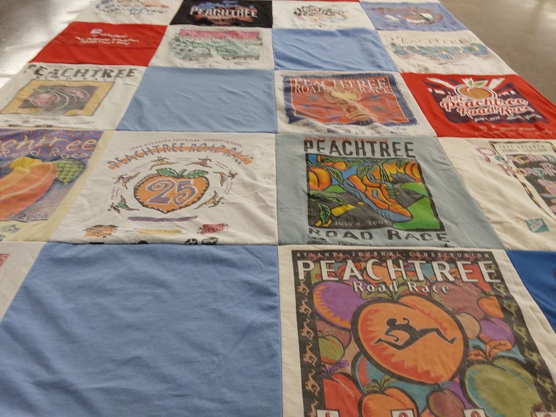 T-shirt quilt with running, sports themes by Bruce from GA