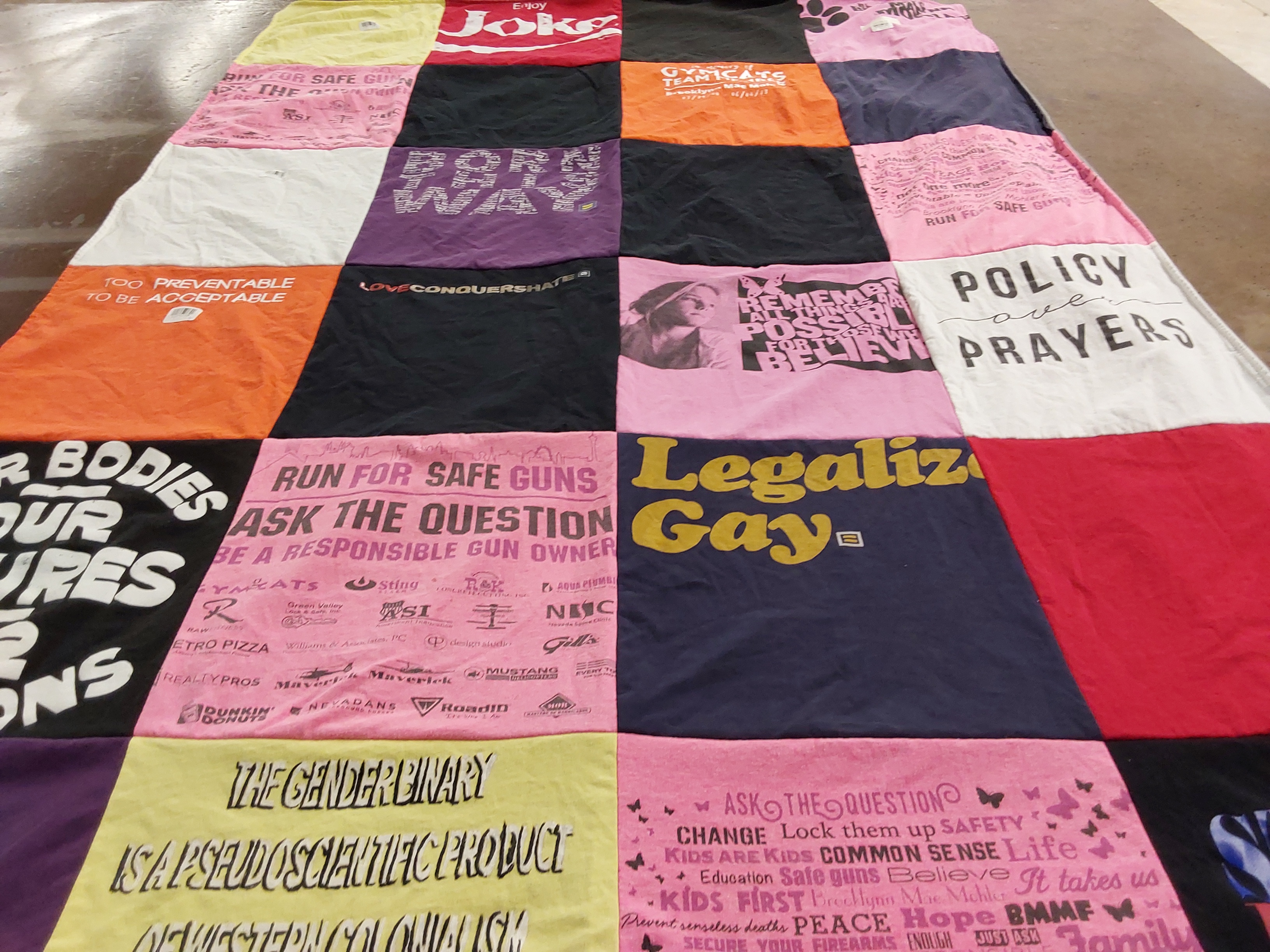 T-shirt quilt with gun safety, gender rights themes by Cassandra from NV