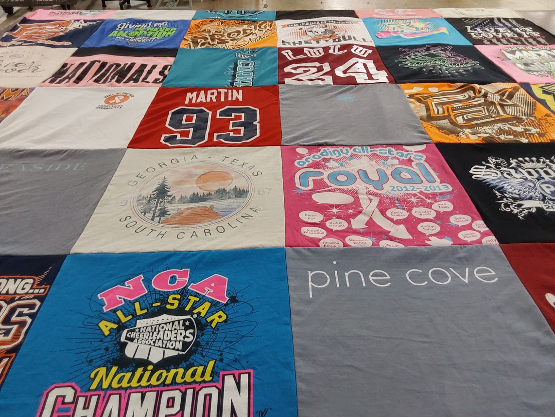 T-shirt quilt with cheerleading themes by Theresa from TX