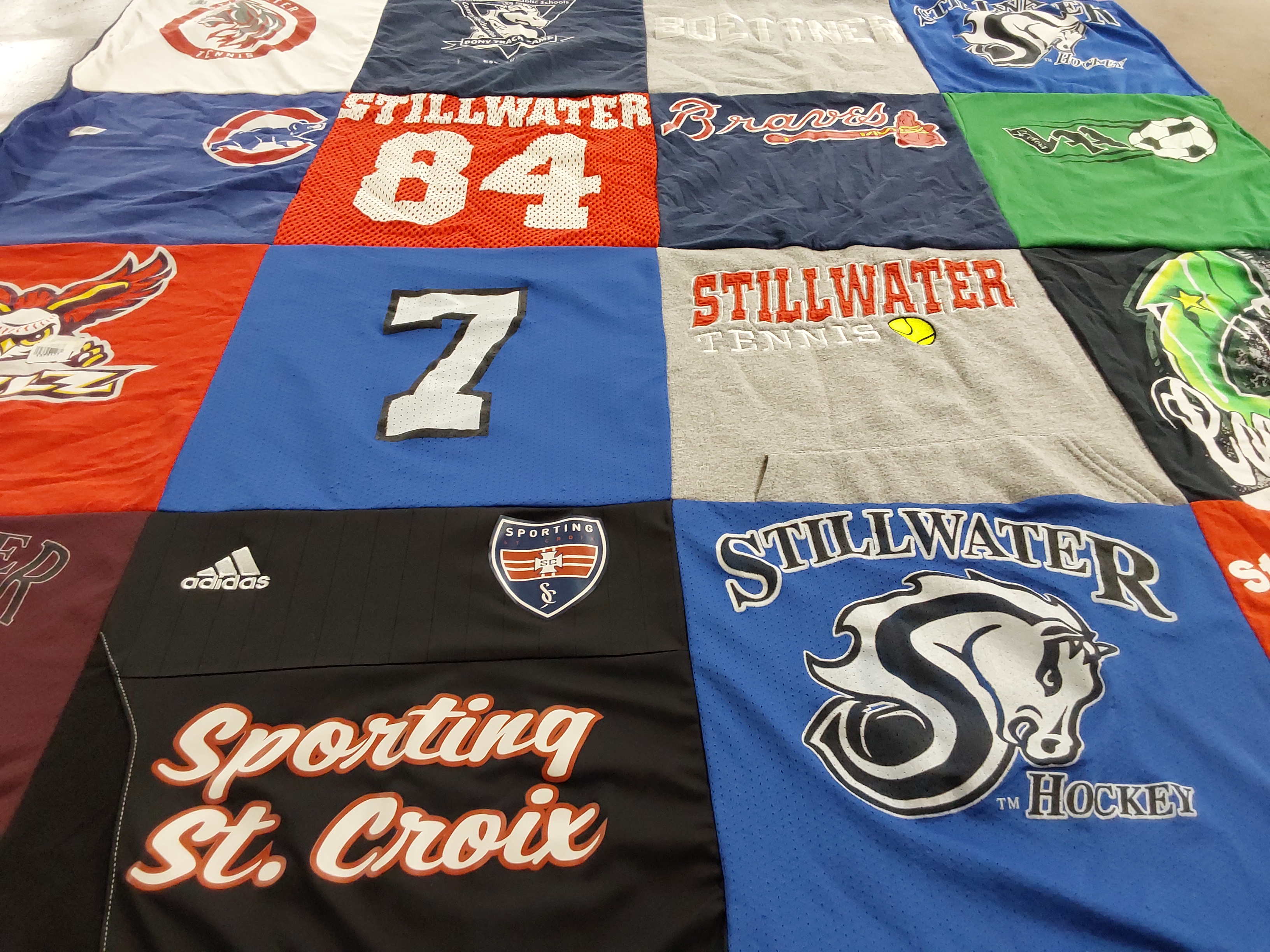 T-shirt quilt featuring stillwater hockey, stillwater tennis by Tessa from TX