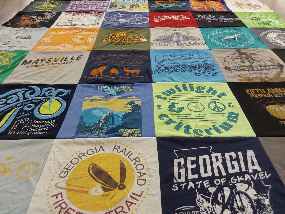 T-shirt quilt with cycling, community events themes by Lisa from GA