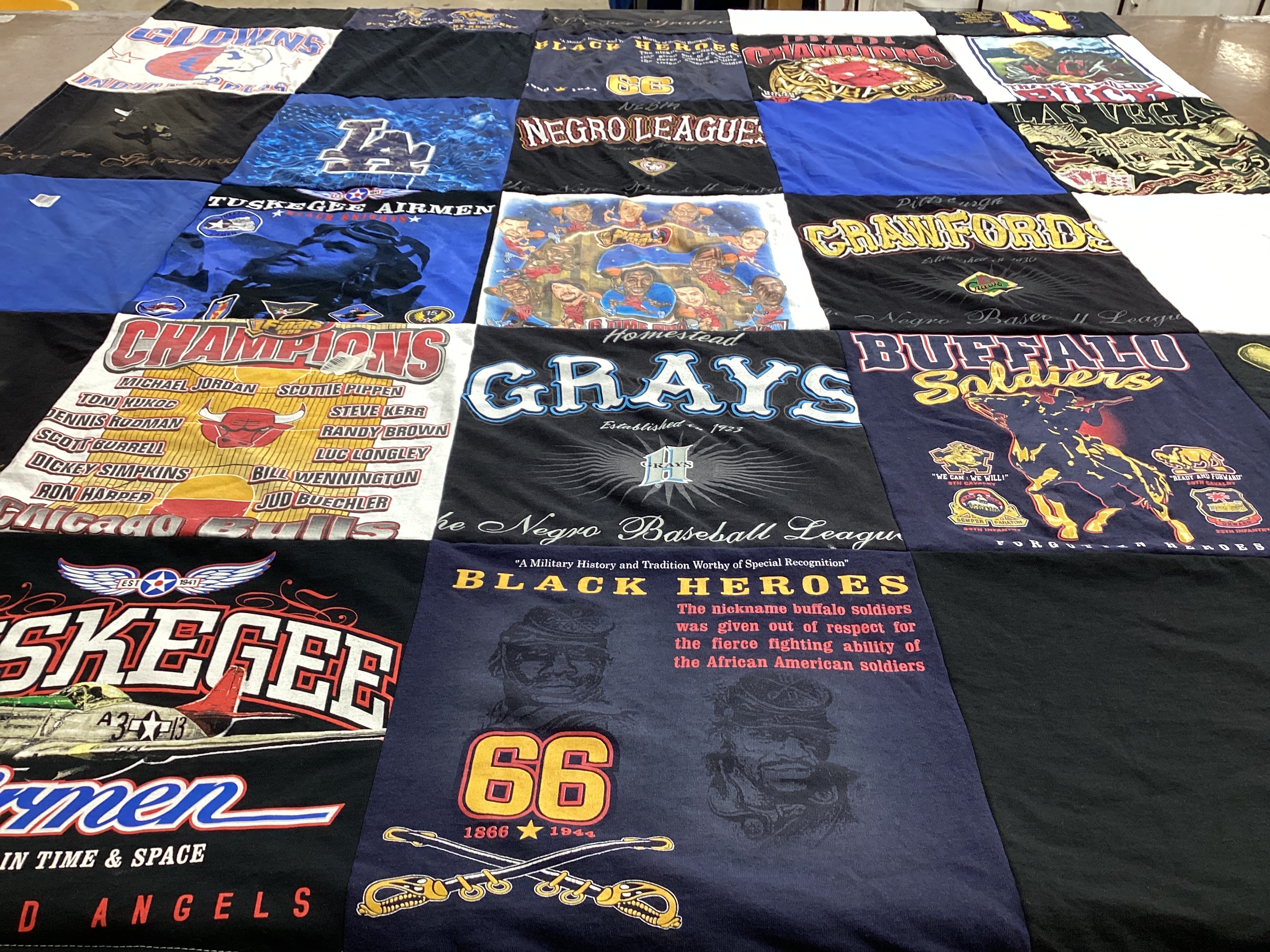 T-shirt quilt with sports, history themes by Florence from IL