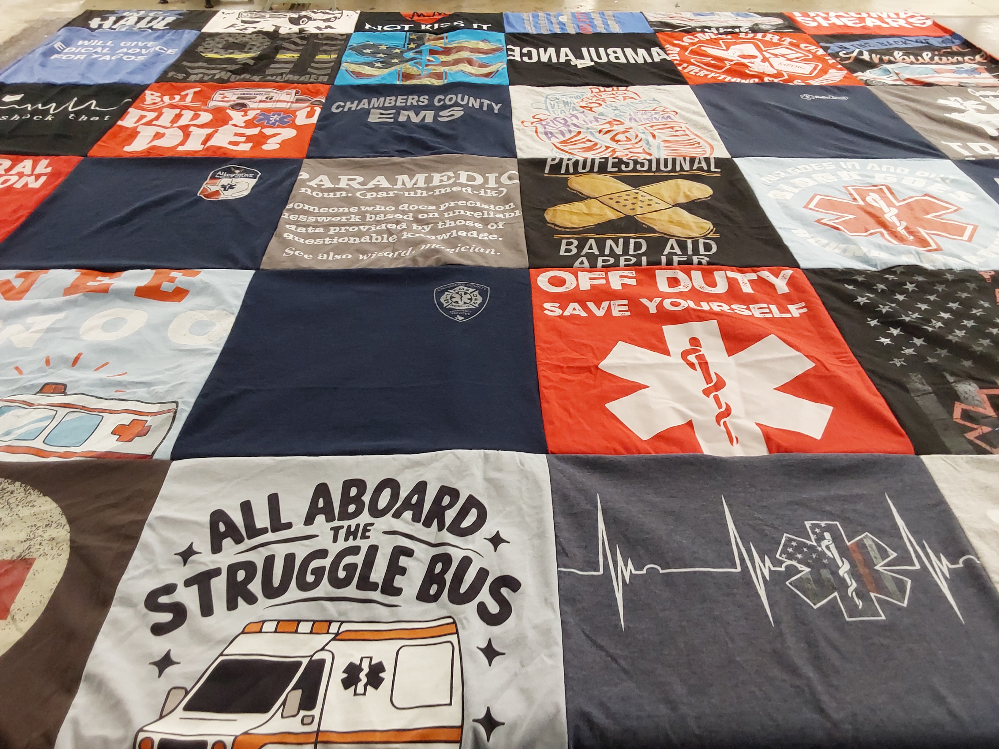 T-shirt quilt with emergency medical services, healthcare themes by Julie from TX