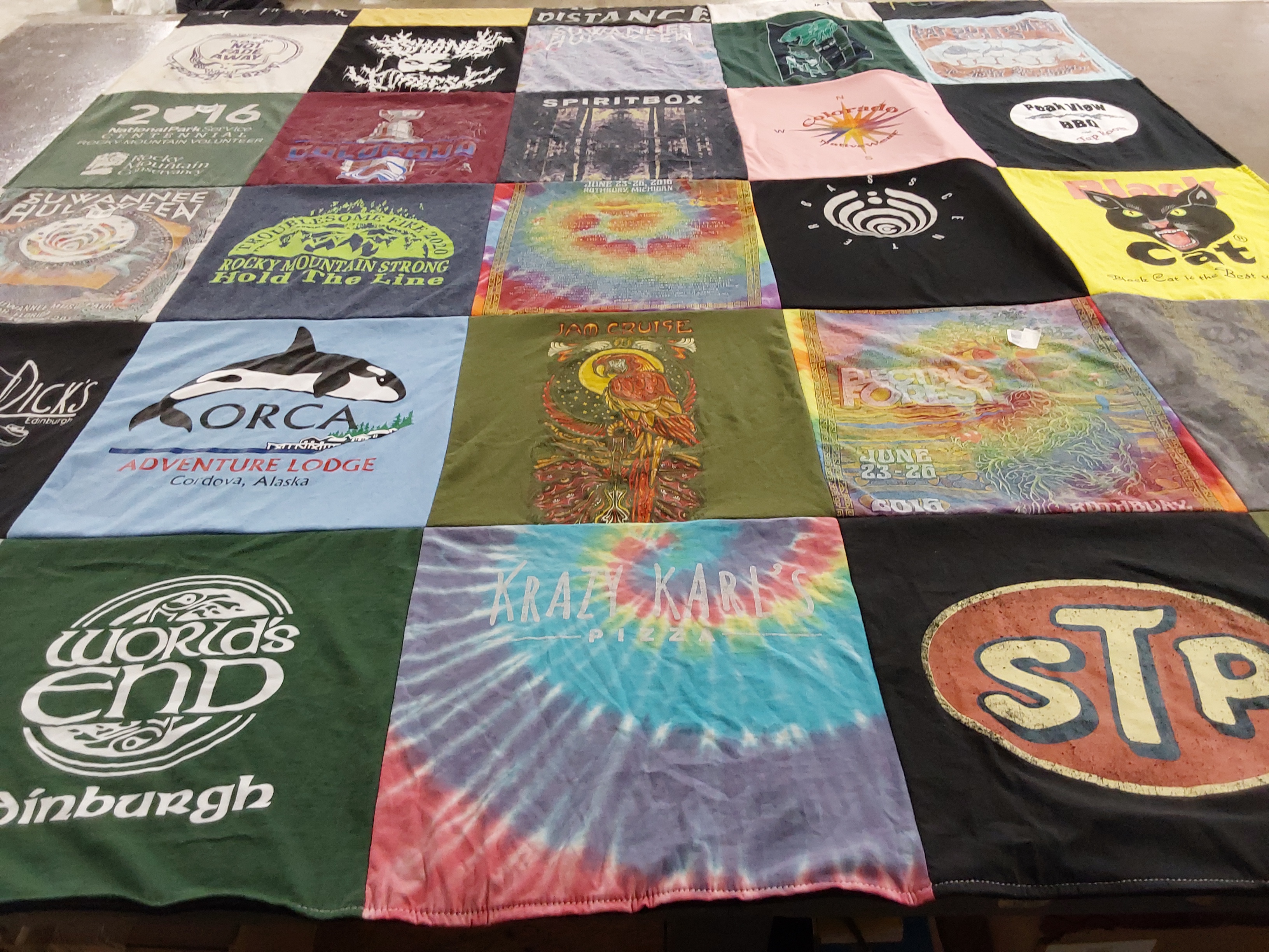 T-shirt quilt with adventure, travel themes by Morgan from CO