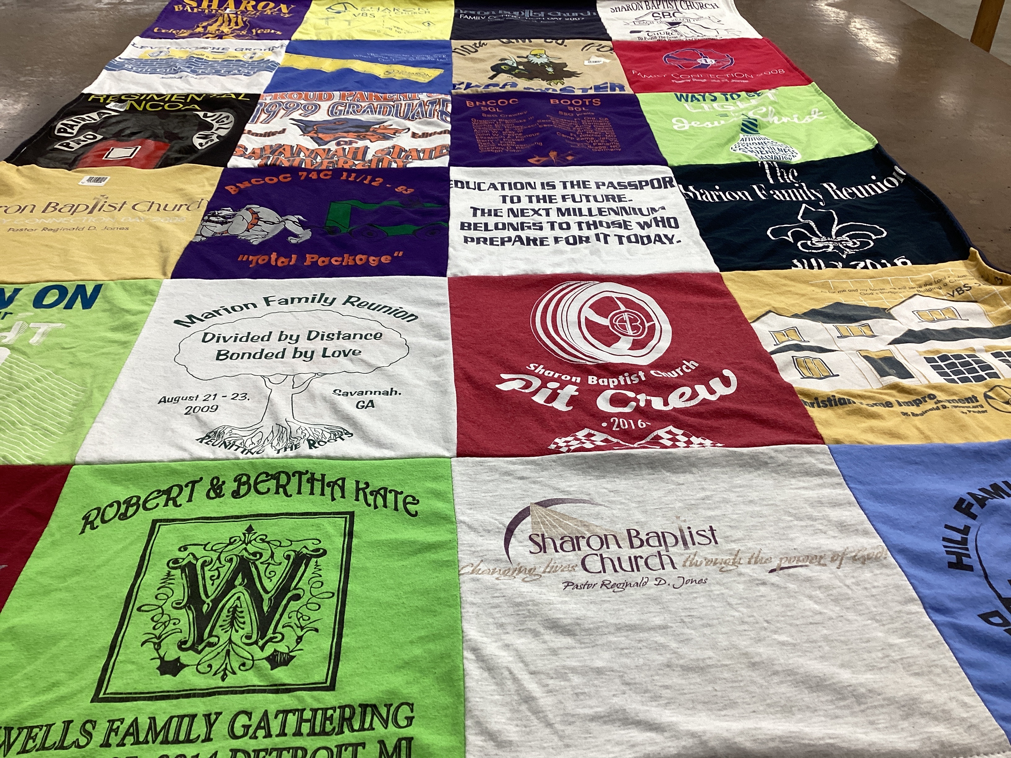 T-shirt quilt with family, community themes by Patricia from GA