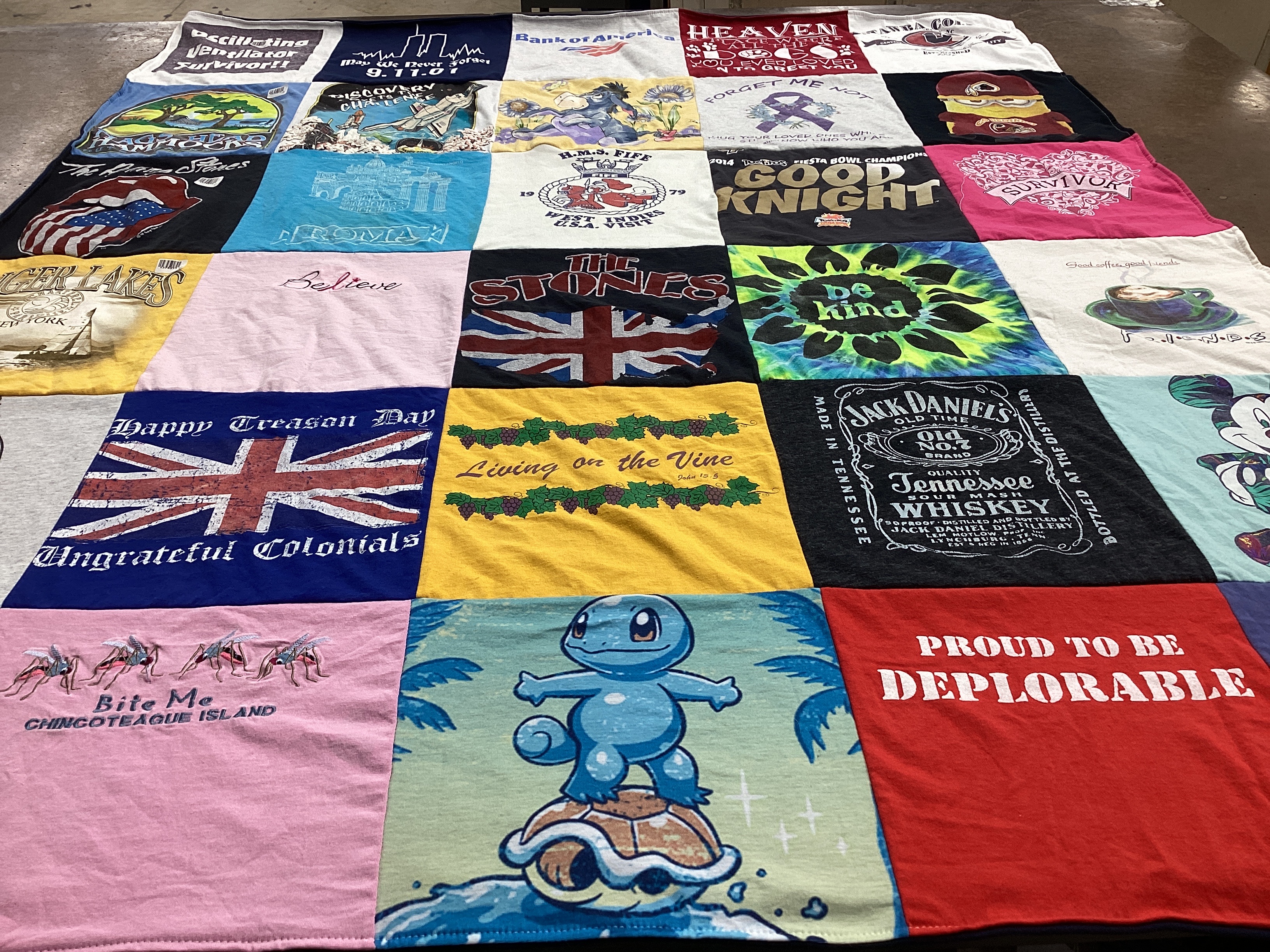 T-shirt quilt with gaming, whiskey themes by Cynthia from FL