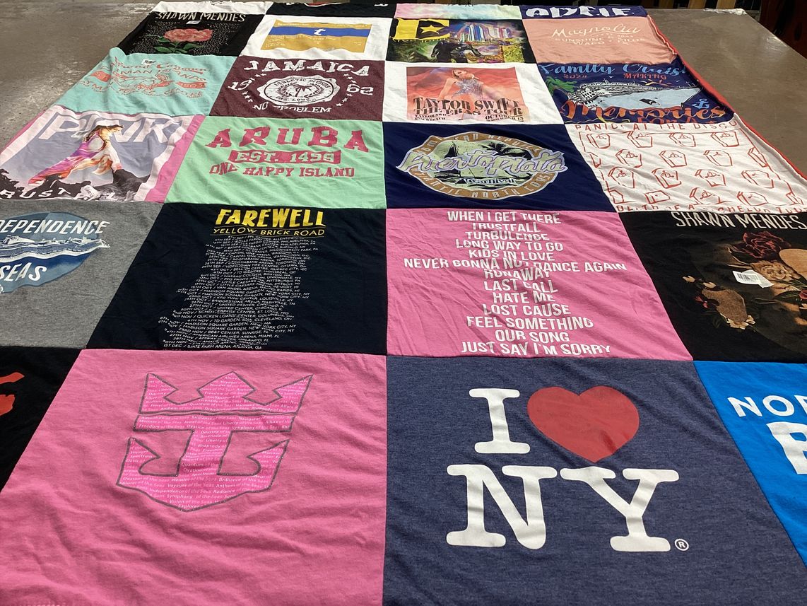 T-shirt quilt with travel, music themes by Crystal from TX