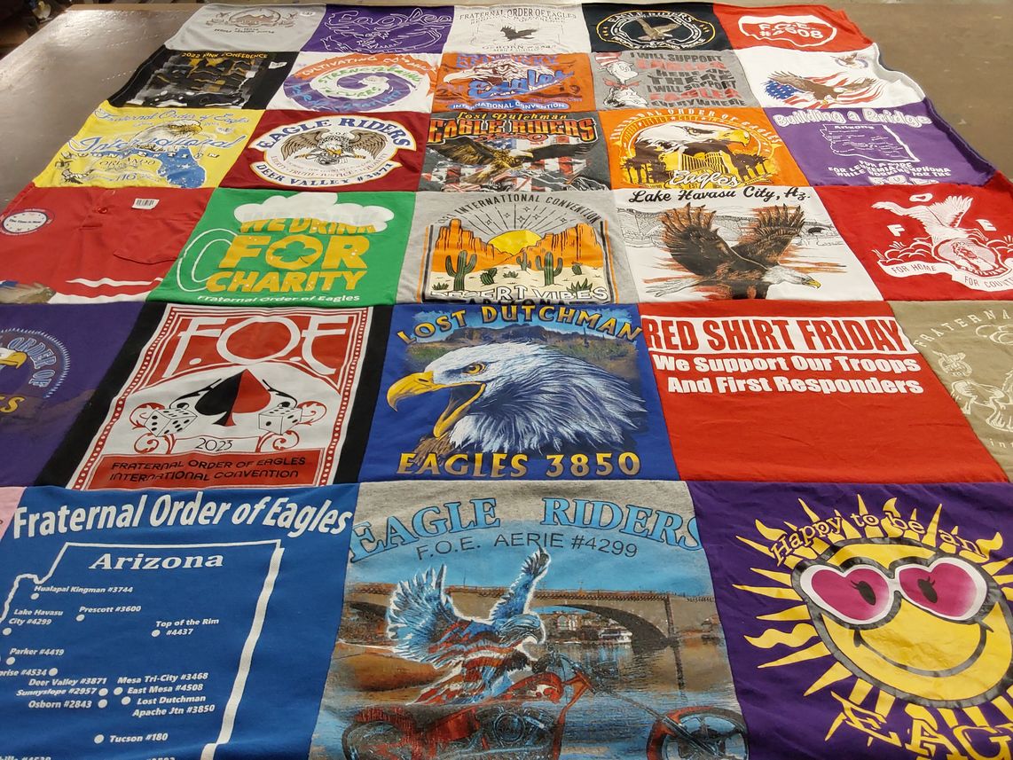 T-shirt quilt with community service, veteran support themes by Tammy from AZ