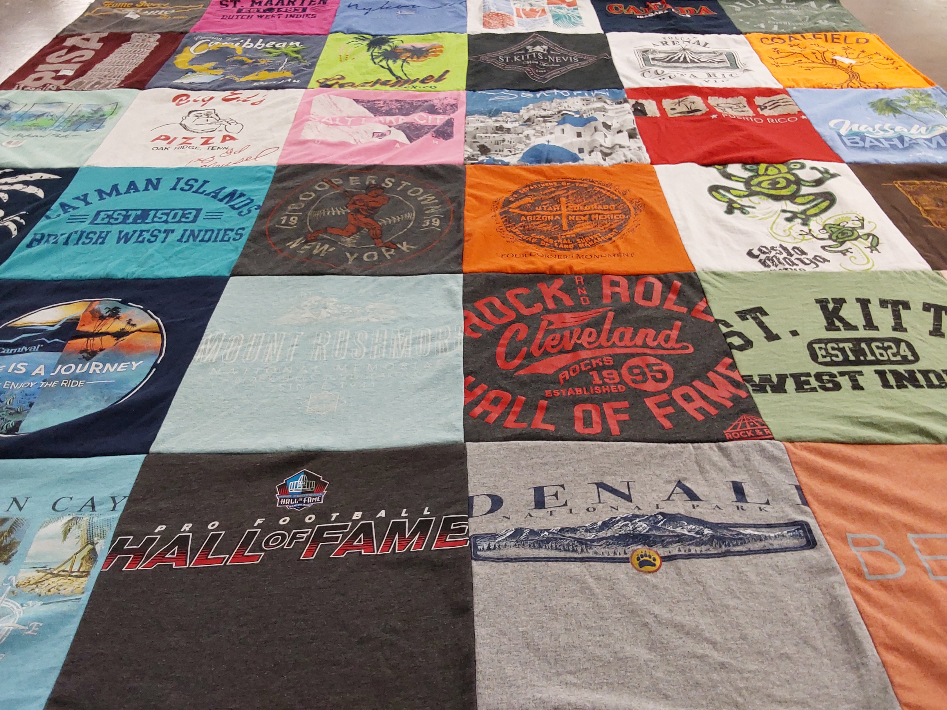 T-shirt quilt with travel, music themes by Paula from TN