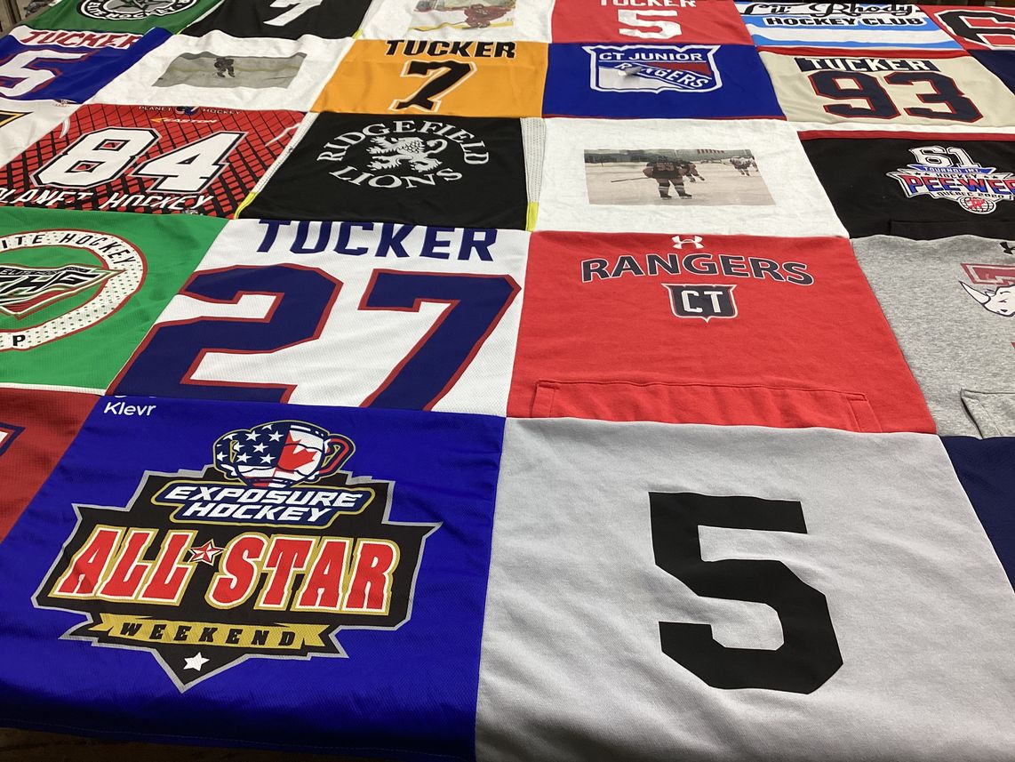 T-shirt quilt with hockey themes by Stacey from RI