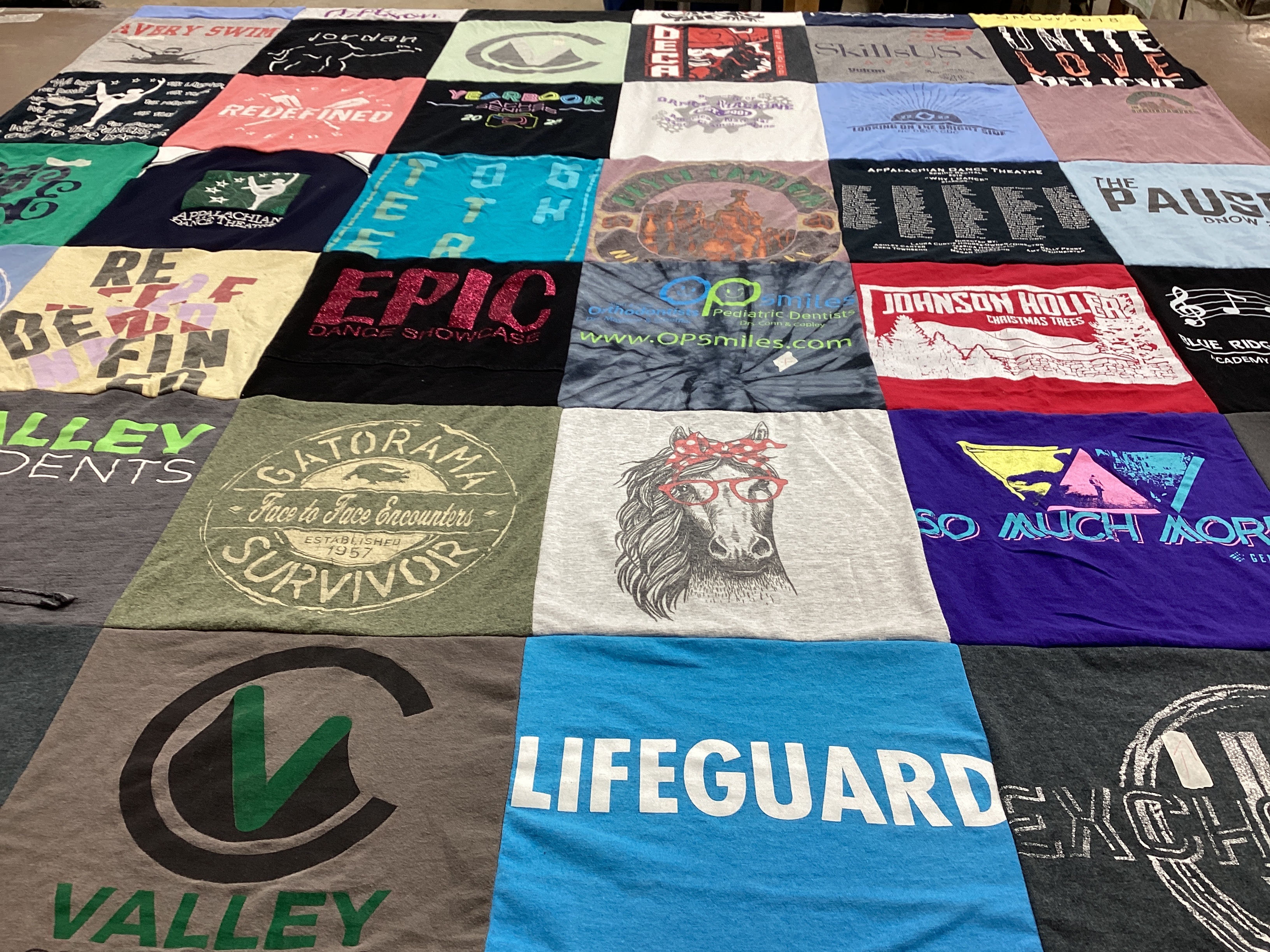 T-shirt quilt with dance, theater themes by Charity from NC