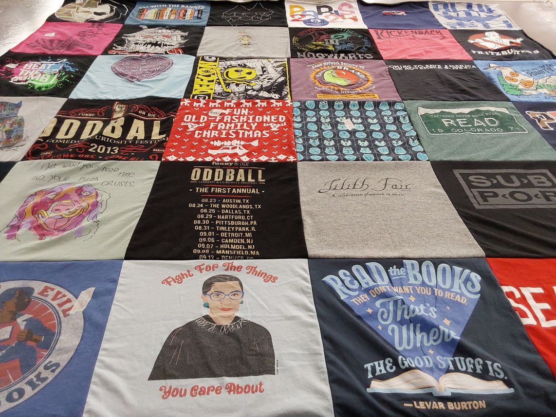 T-shirt quilt with comedy, music themes by Anne from CO